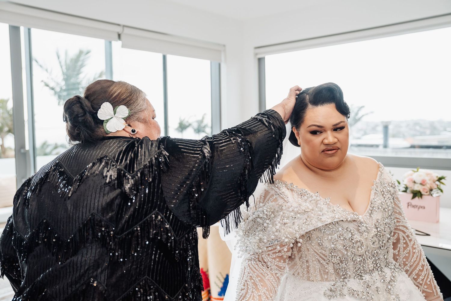 Beautiful beaded lace details on a wedding dress with a cathedral length train.