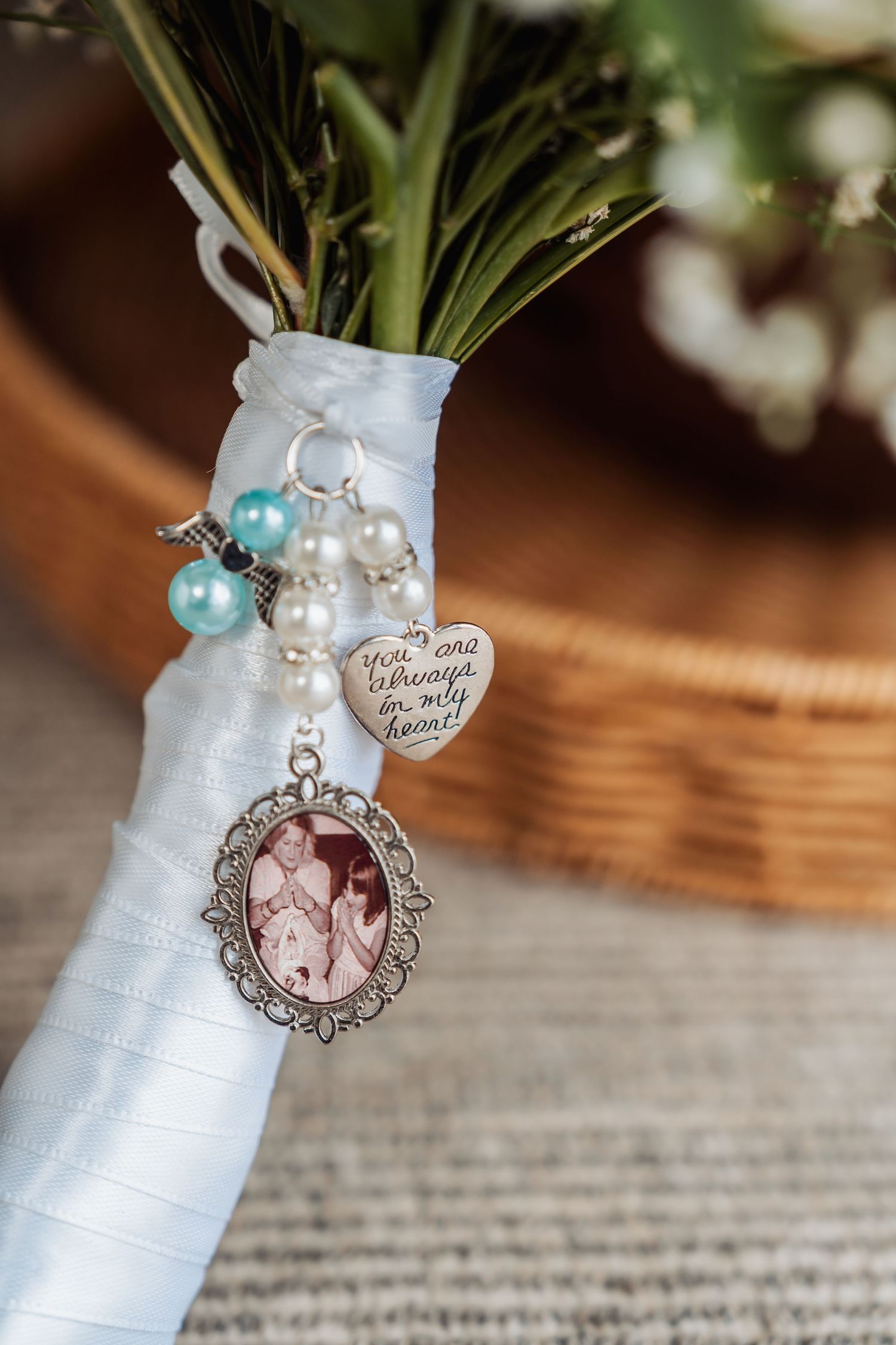 Wedding bouquet charm with pearl beads, heart pendant reading you are always in my heart, and vintage photo memorial locket.