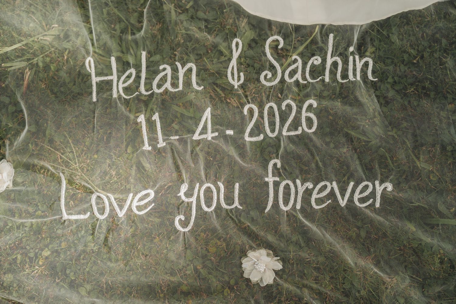 Wedding keepsake engraved with Helan and Sachin 11-4-2026 Love you forever on decorative stone surface.