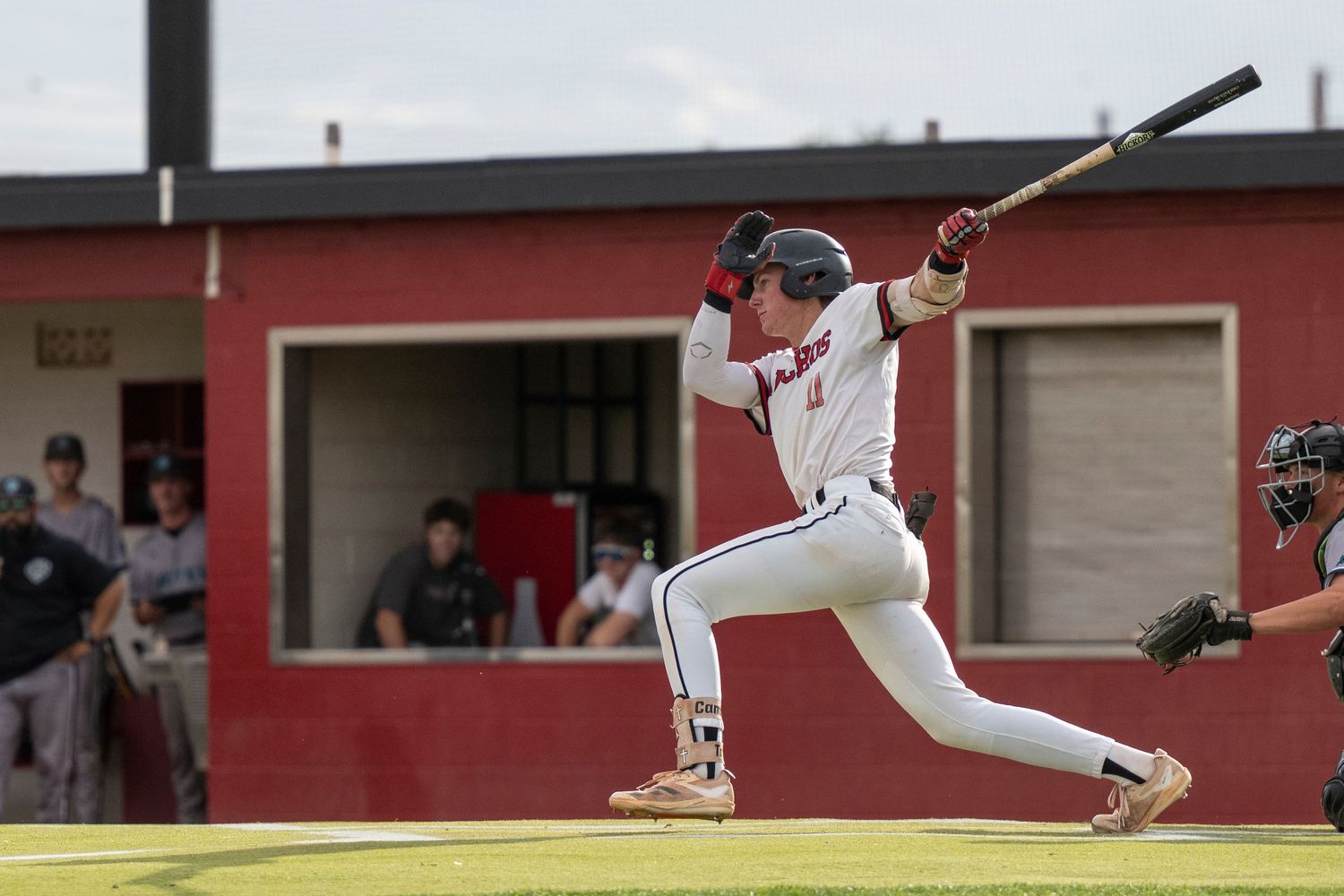 Baseball player on home base batting.