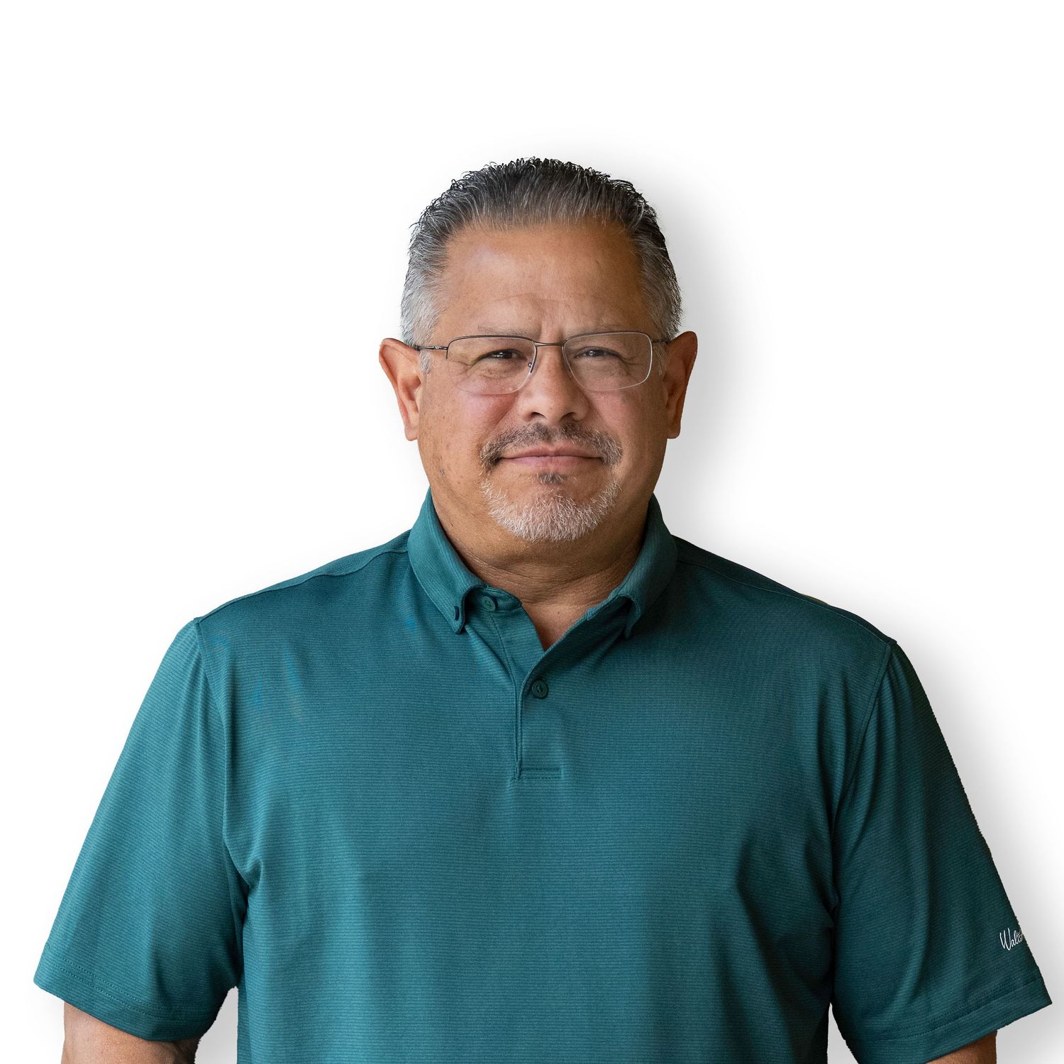 A man in front of a white background posed for a headshot.