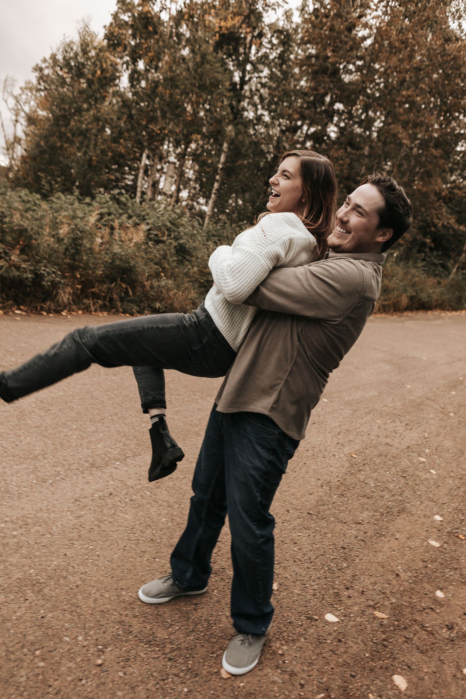 A sequence of photos showing two people practicing martial arts moves in a park during autumn.