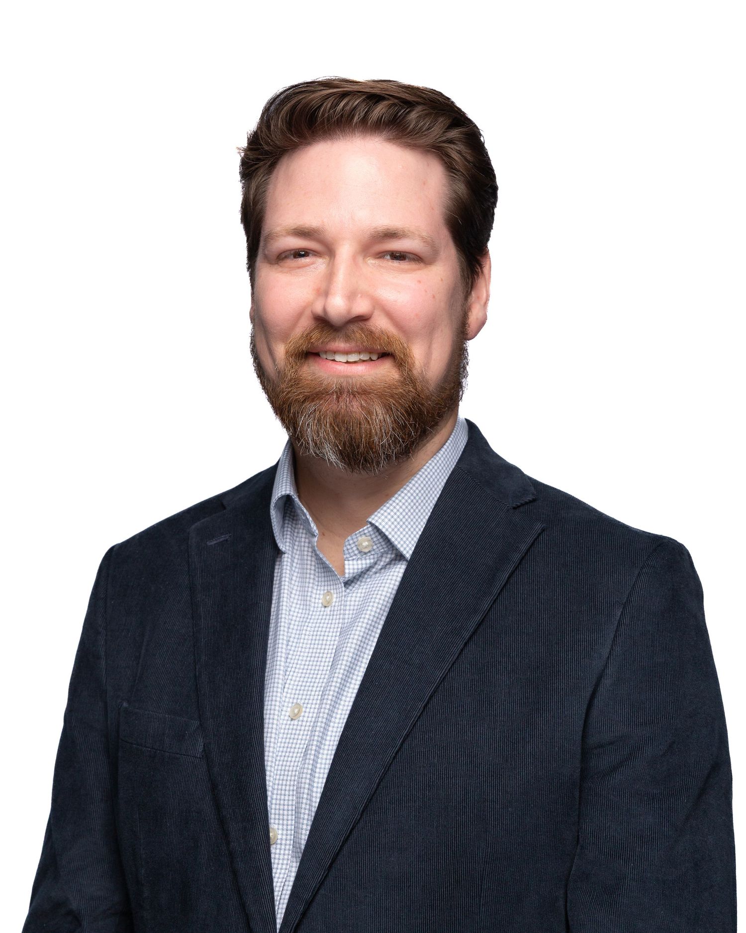 Portrait of team member at Firefighters First Credit Union, kind expression, photographed under studio light for web, email, and socials.