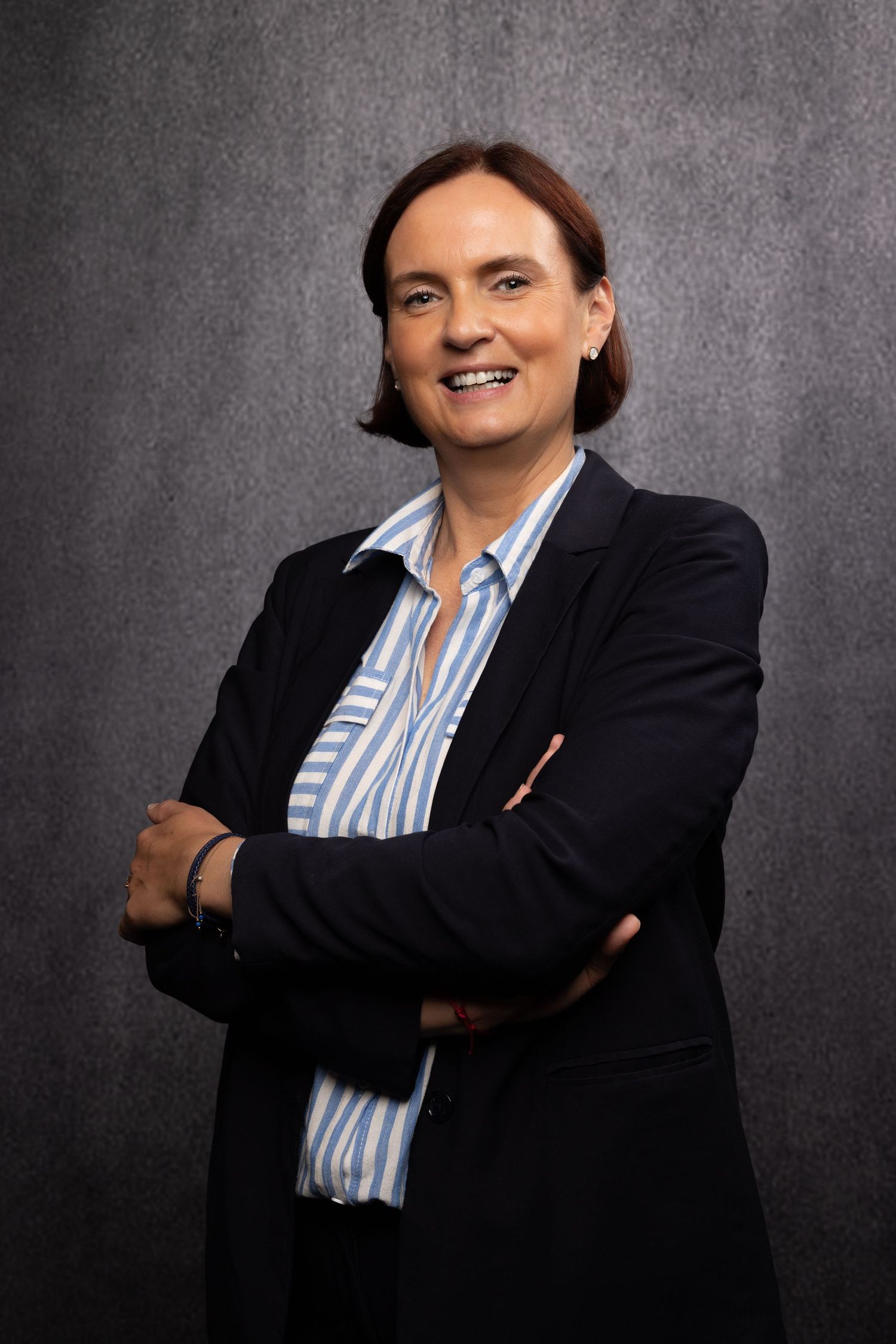 Corporate member portrait at JW Marriott, confident, approachable expression and natural true-to-color lighting.