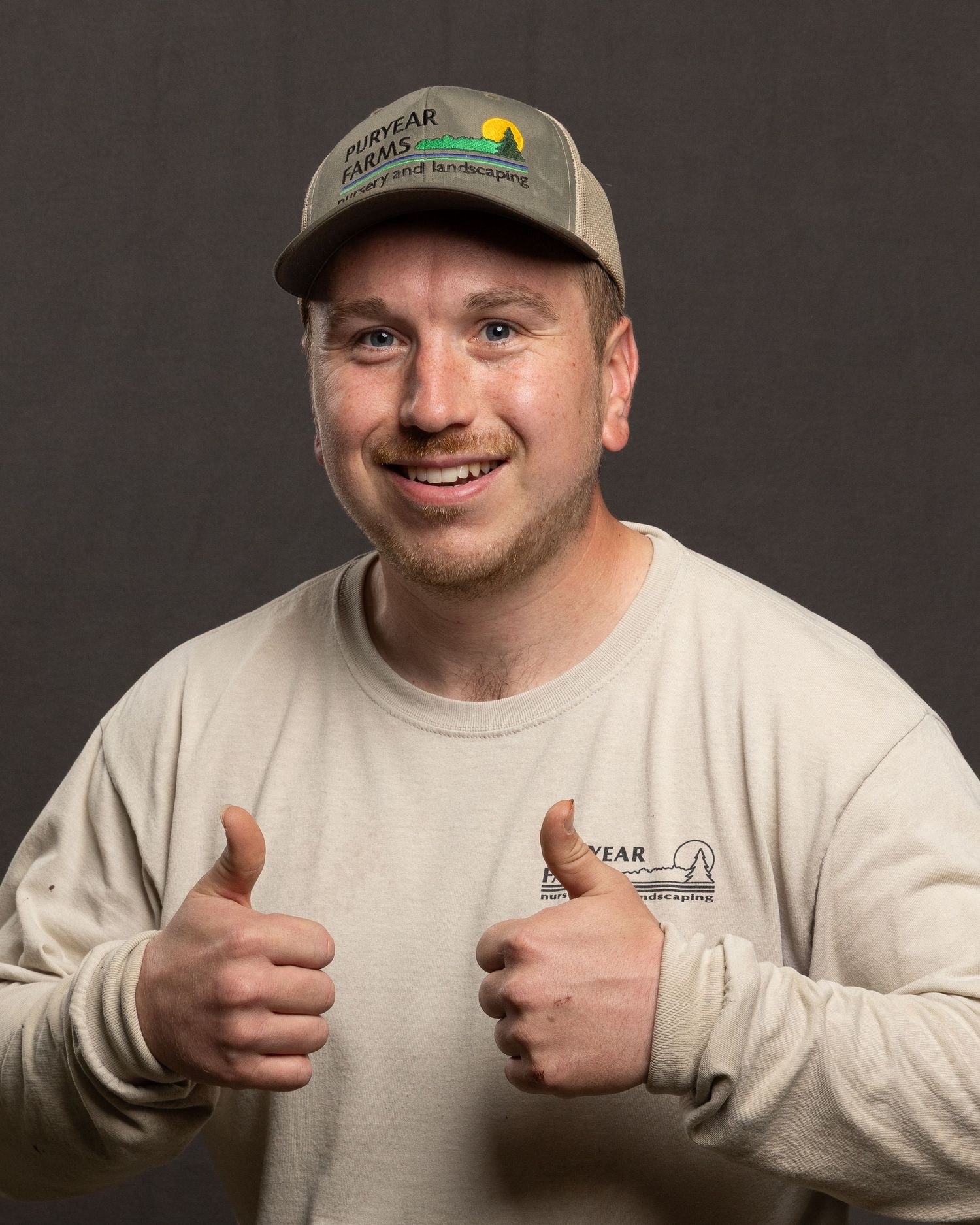 Individual headshot for Puryear Farms, playful and consistent, photographed with portable backdrop and lighting.
