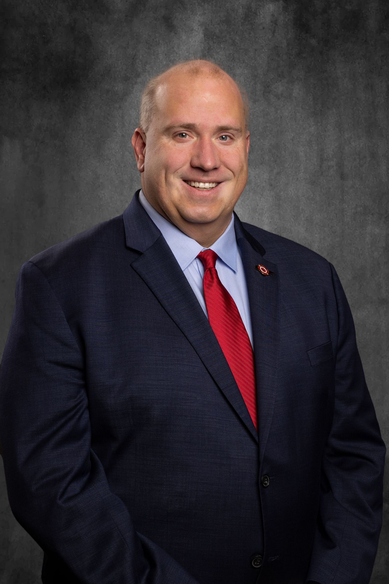 Non-profit headshot for President of Tennessee Professional Firefighters Association, Matthew Tomek, on virtual background.