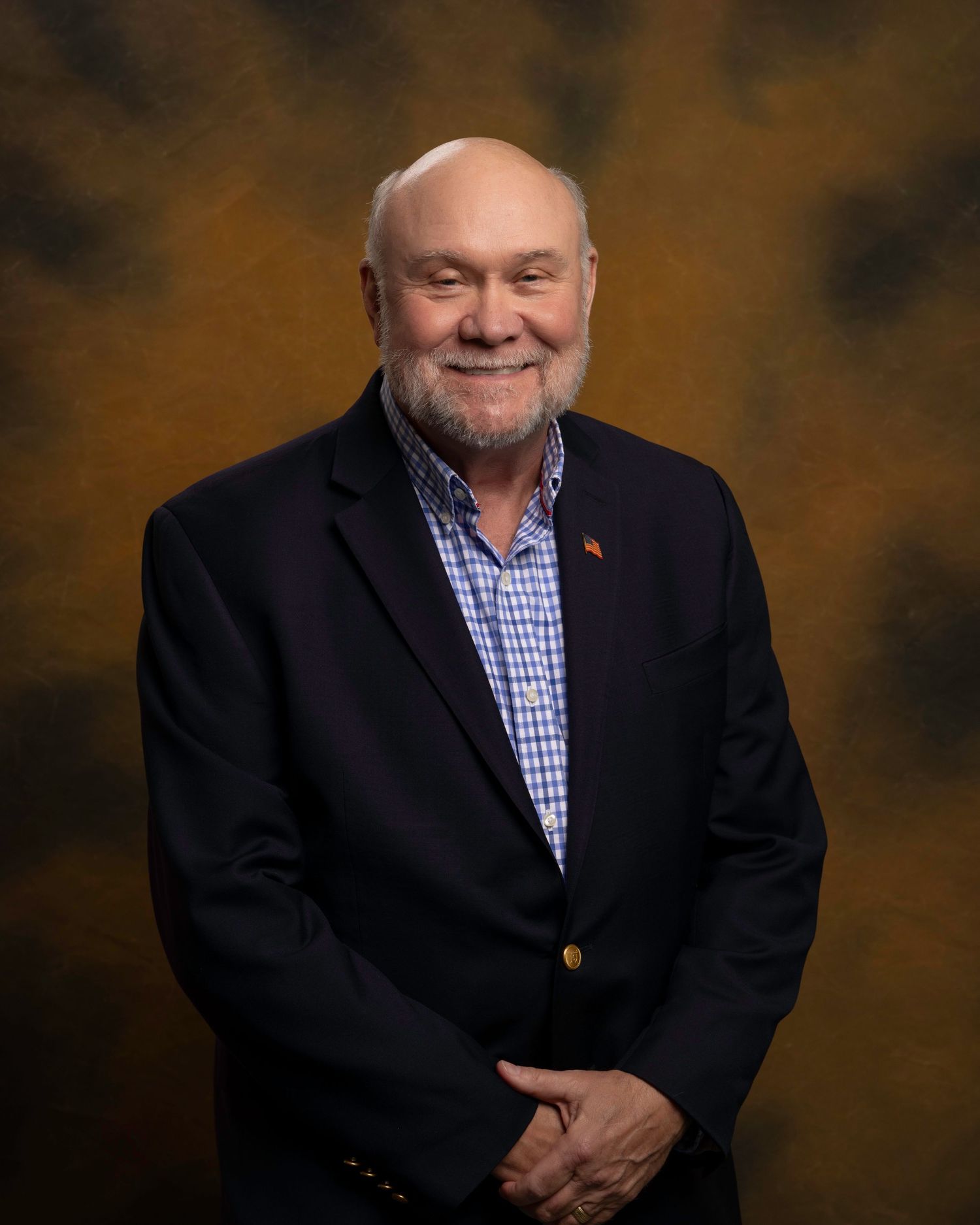 Executive headshot for board member, smiling and polished look with custom background, captured for NWTF Foundation.