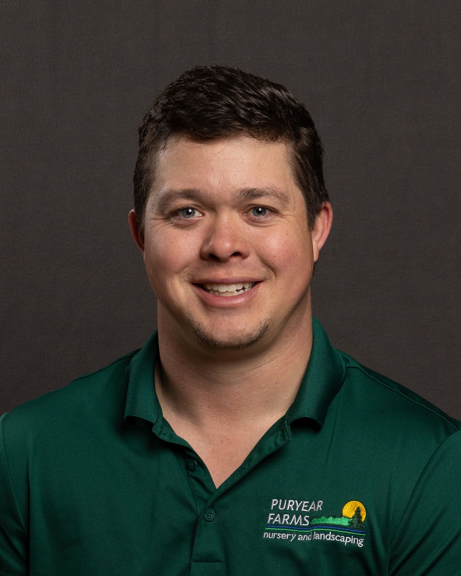 Sales team portrait for Puryear Farms, professional demeanor and natural, photographed with portable backdrop and lighting.