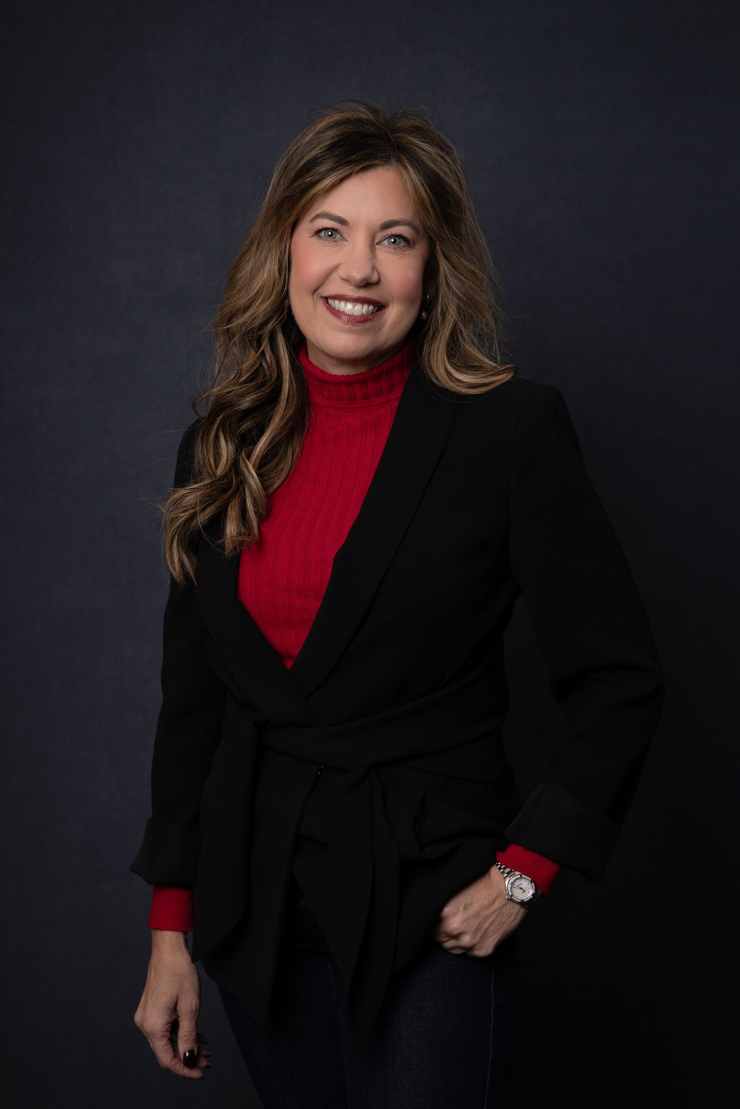 Portrait of team member at Quality Uptime, classic and personable expression, photographed under natural studio light.