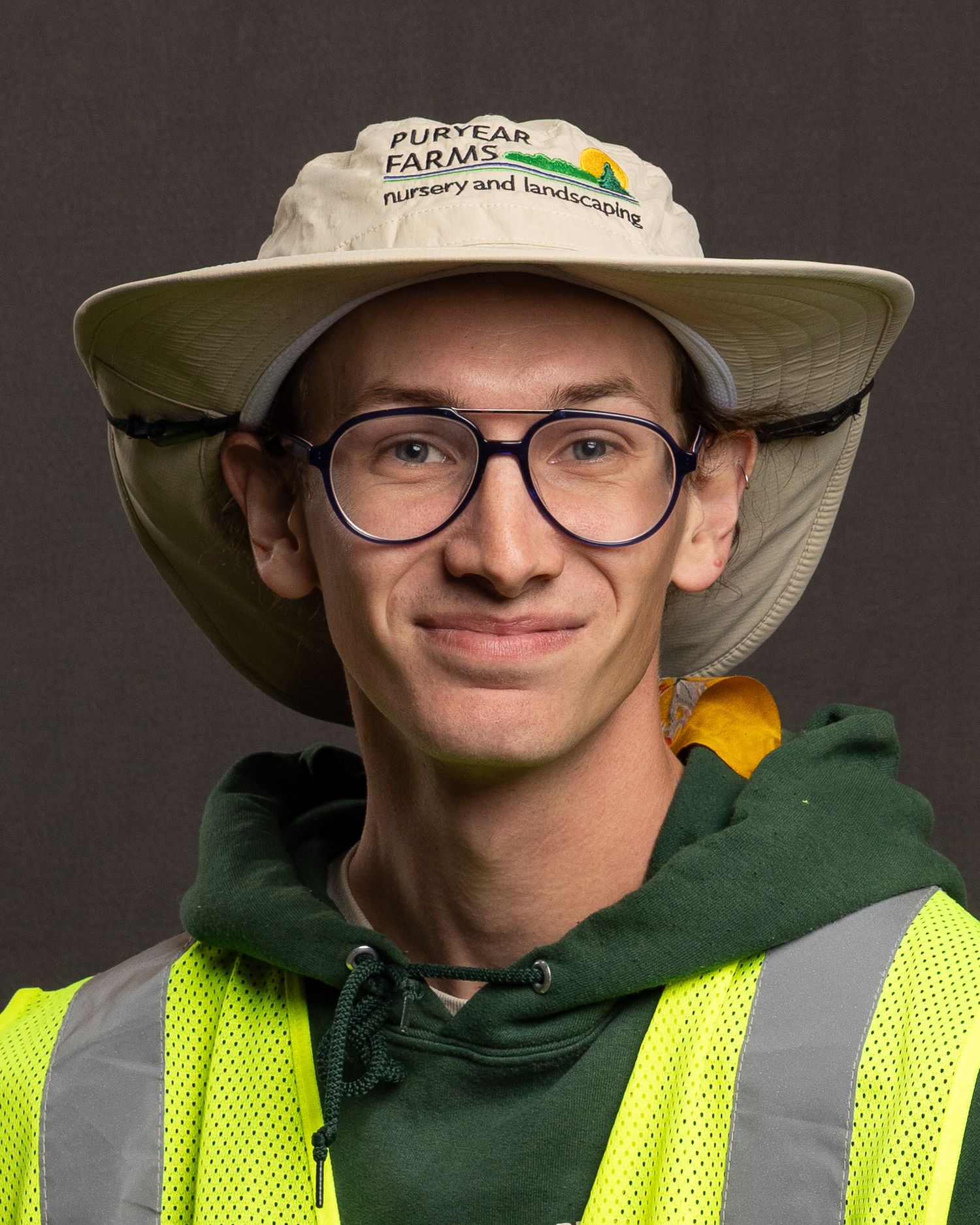 Individual headshot for Puryear Farms, approachable demeanor and classic, photographed with portable backdrop and lighting.