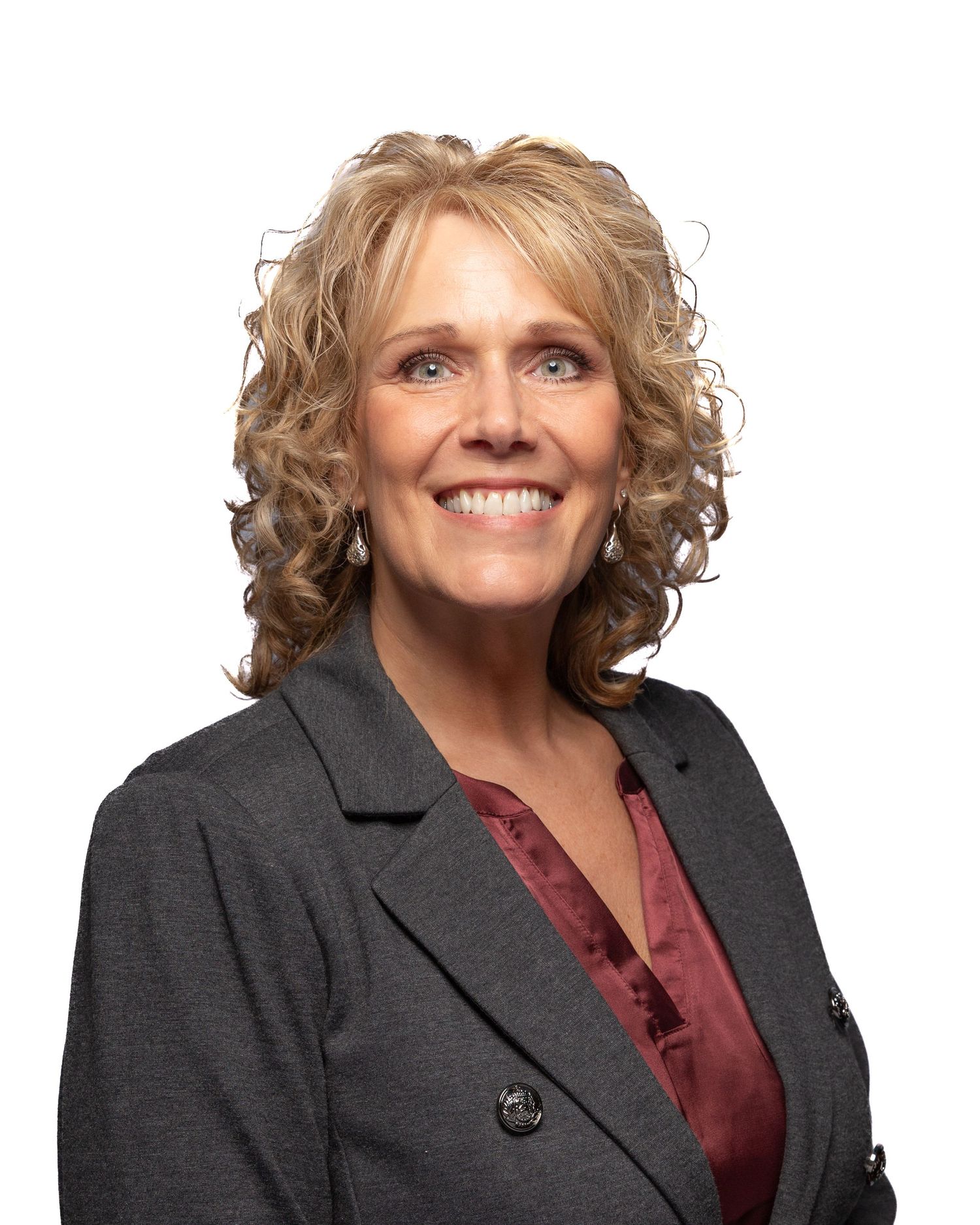 Portrait of team member at Firefighters First Credit Union, kind and clean, photographed under studio light for web, email, and socials.
