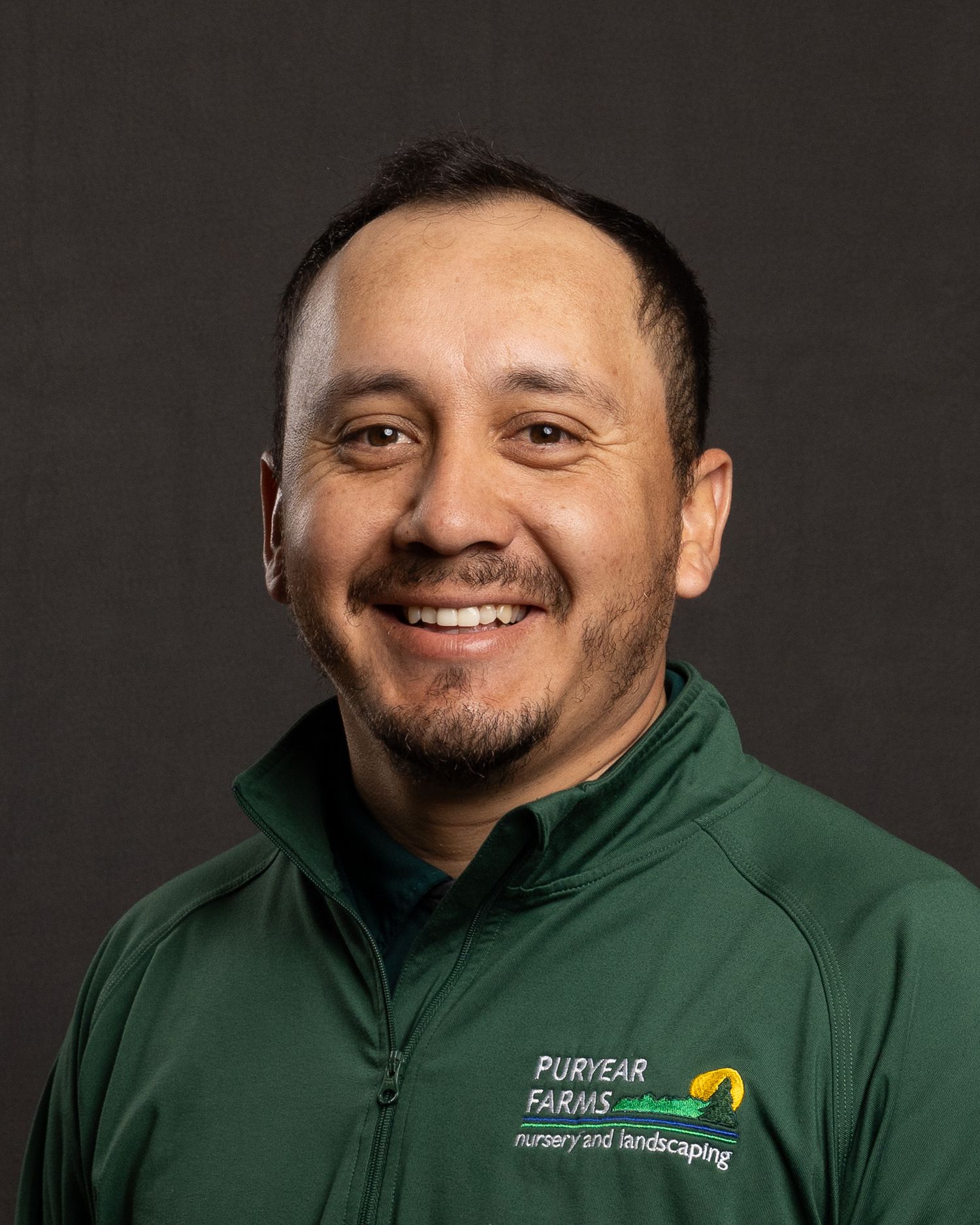Individual headshot for Puryear Farms, friendly demeanor and clean look, photographed with portable backdrop and lighting.