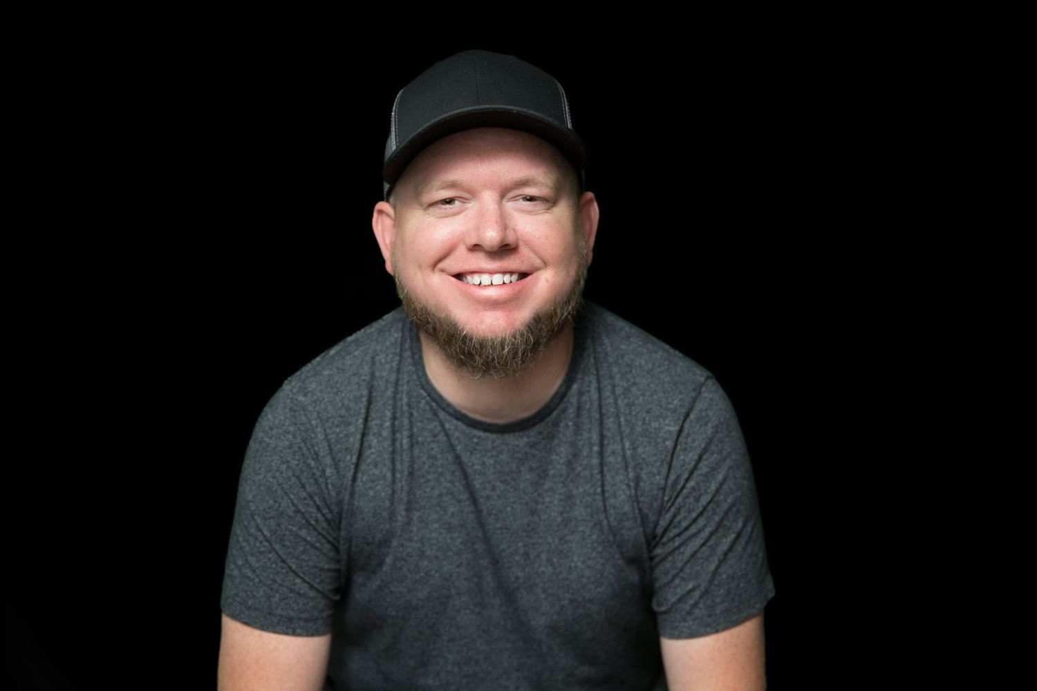 Professional headshot of Jeff Whitlock, founder at 31Digital, smiling and friendly against black backdrop.