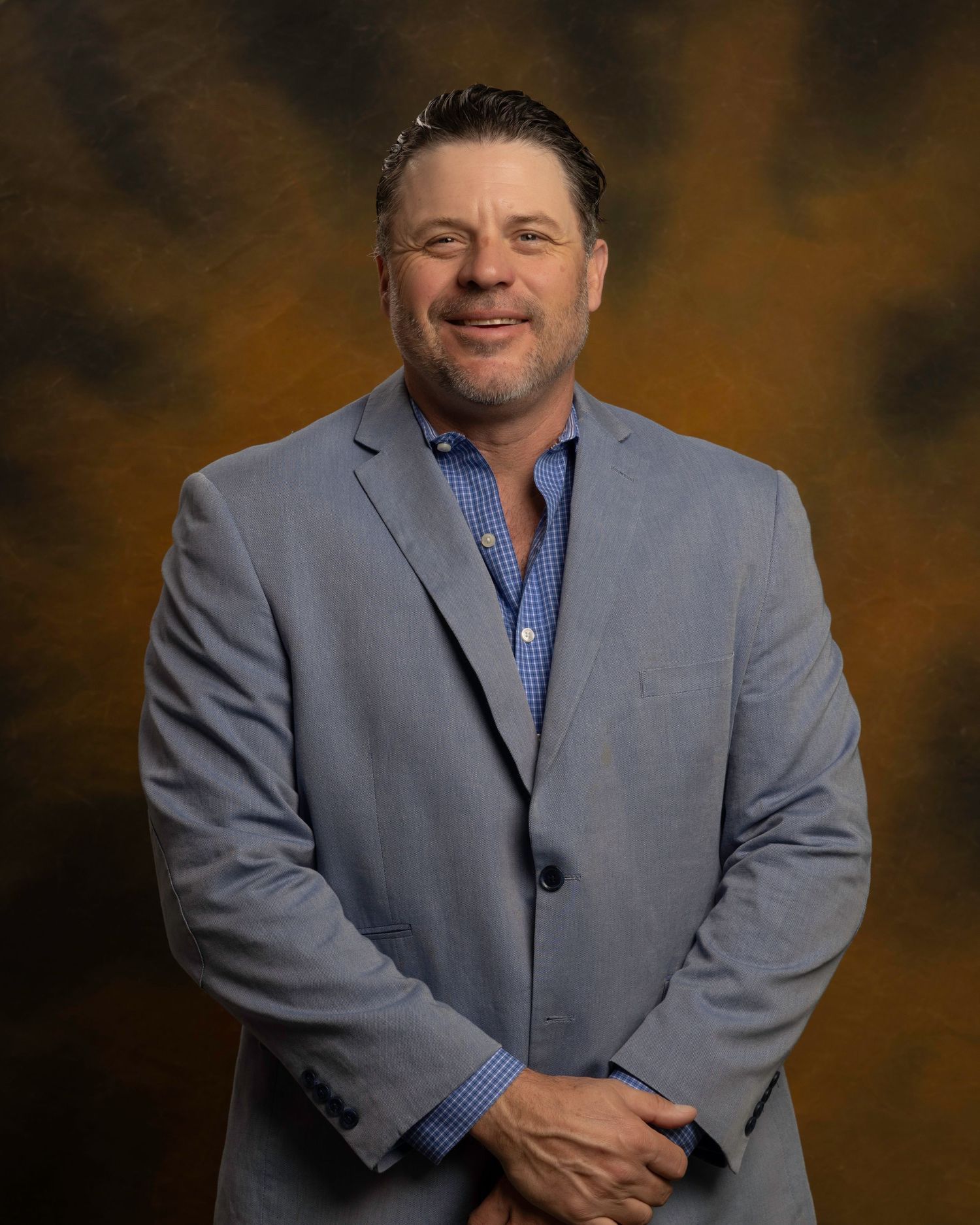 Executive headshot for board member, confident and polished look with custom background, captured for NWTF Foundation.