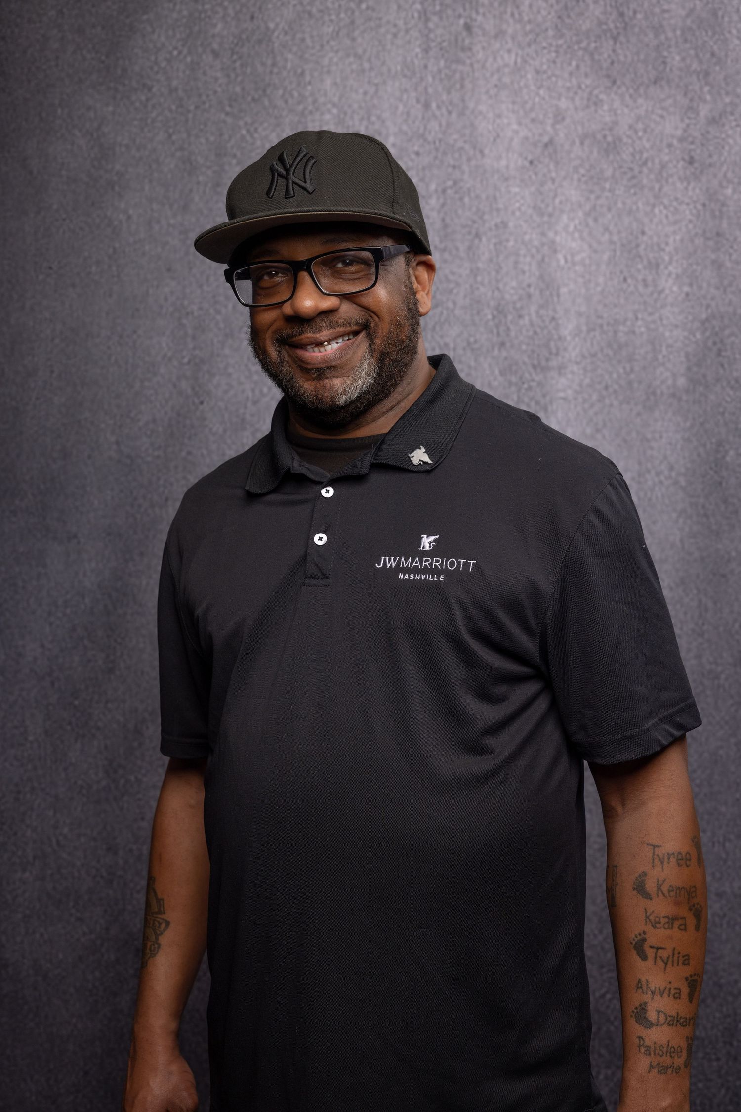 Corporate member portrait at JW Marriott, approachable expression and natural true-to-color lighting.