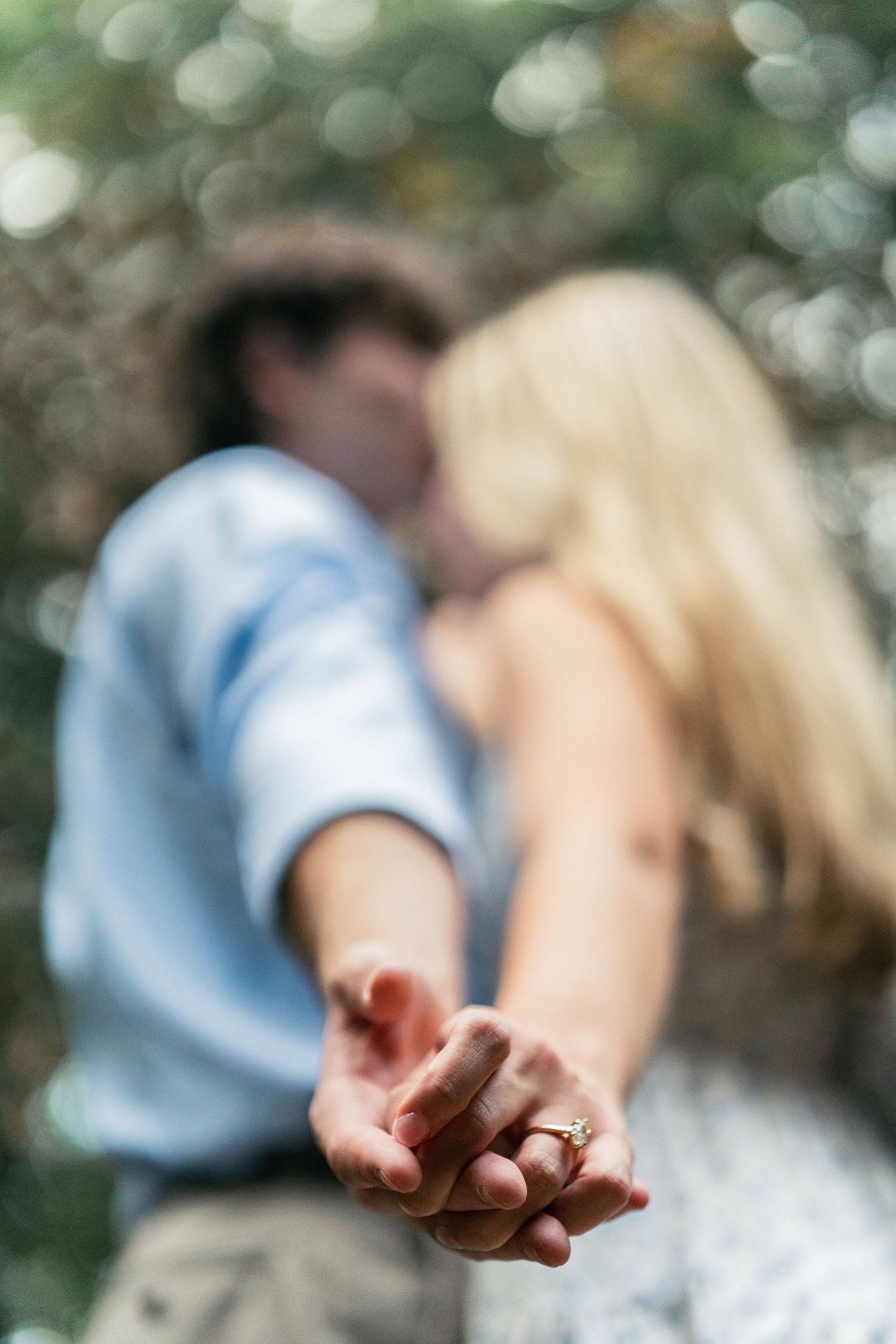 Series of artistic shots showing hands reaching forward with engagement ring in natural lighting.