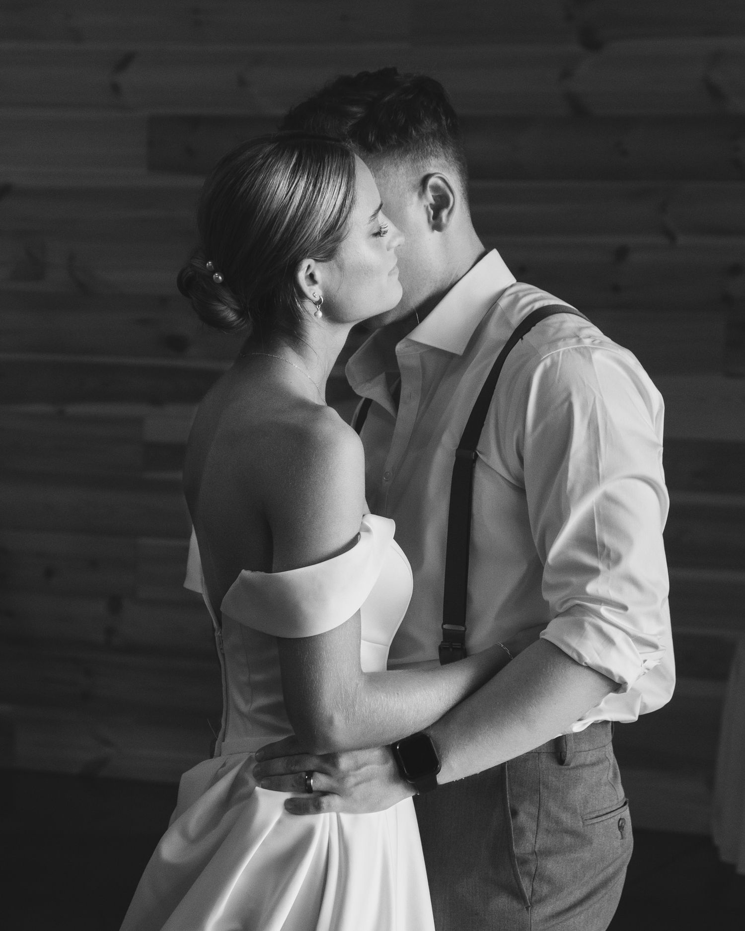 Intimate black and white dance moment at a wedding reception.