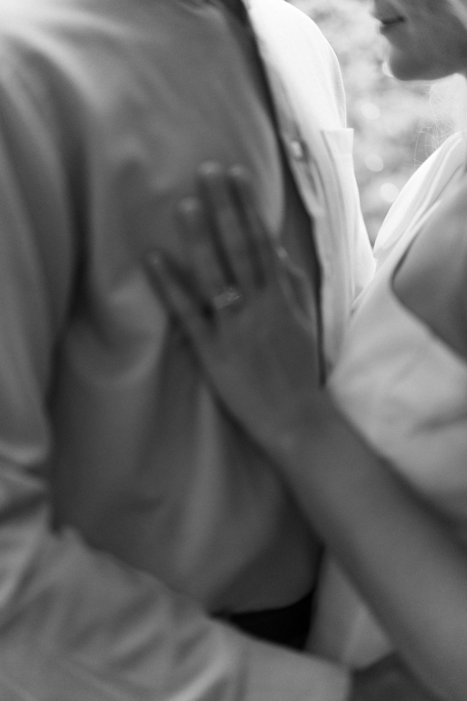 A romantic black and white moment captured between two people.