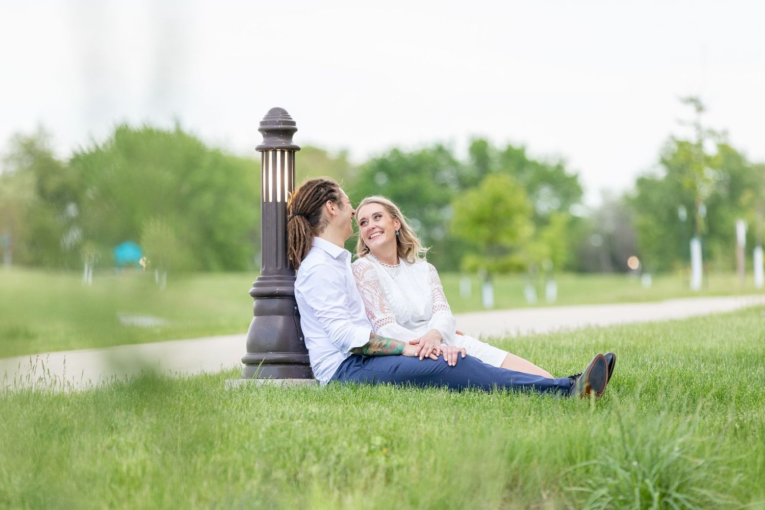 Bride and groom sitting together, sharing a tender moment, captured during a beautifully planned wedding day, reflecting love and joy.