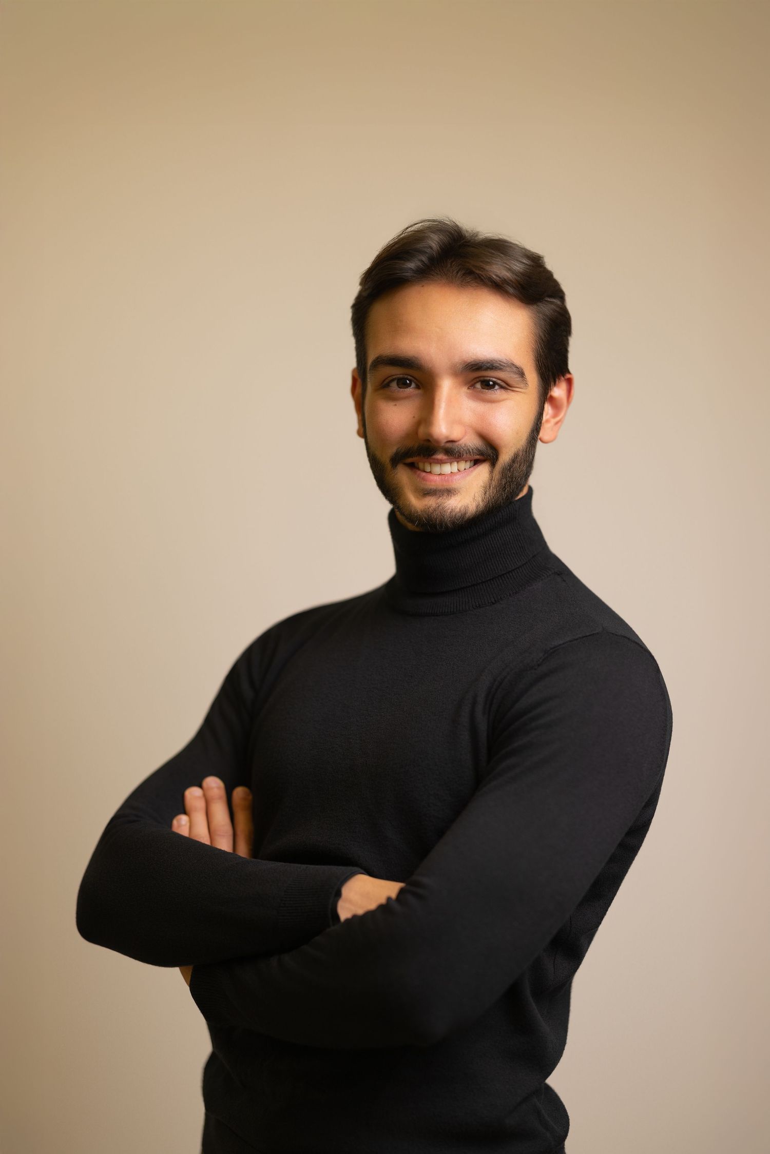 Corporate headshot of a man in a black turtleneck, editorial business portrait Brussels