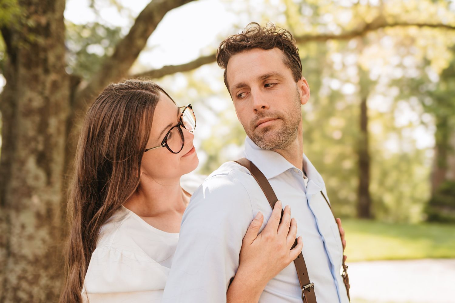 Couple standing close looking at each other during outdoor morning session on lookout mountain Georgia, morning light through trees