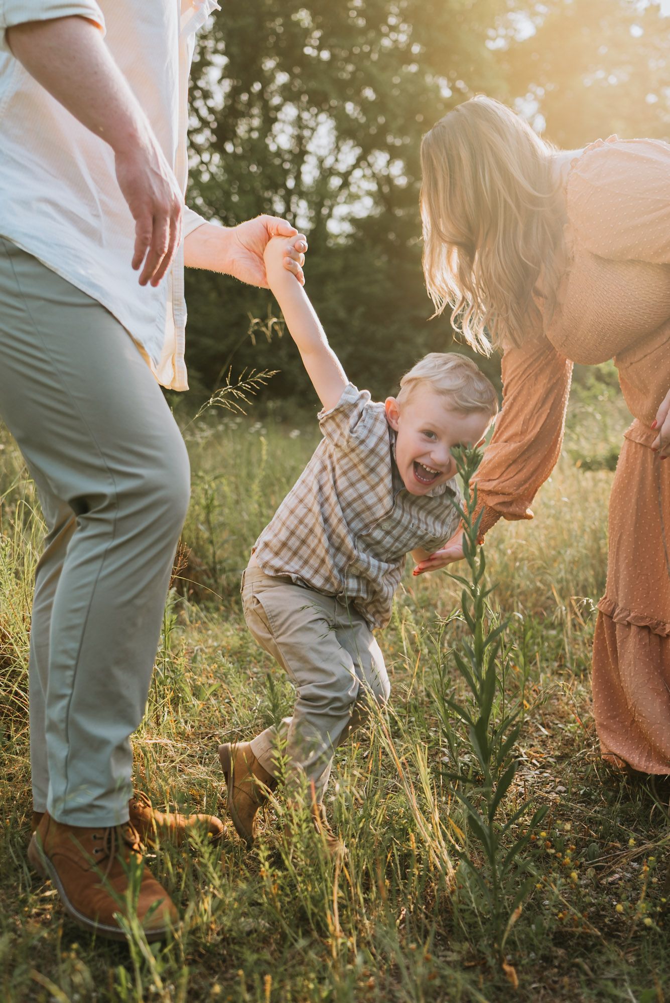 Close up of toddler playing in field during golden hour family maternity session raccoon mountain Chattanooga TN