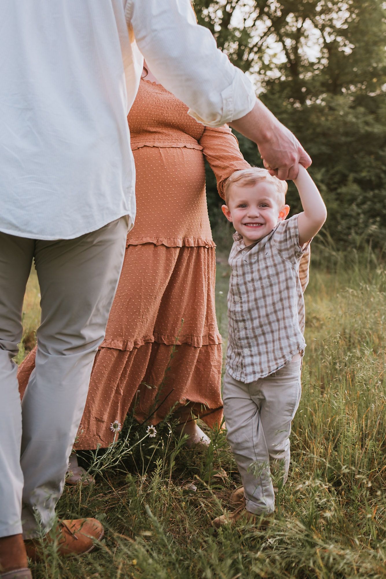 Close up of toddler spinning in field during golden hour family maternity session raccoon mountain Chattanooga TN