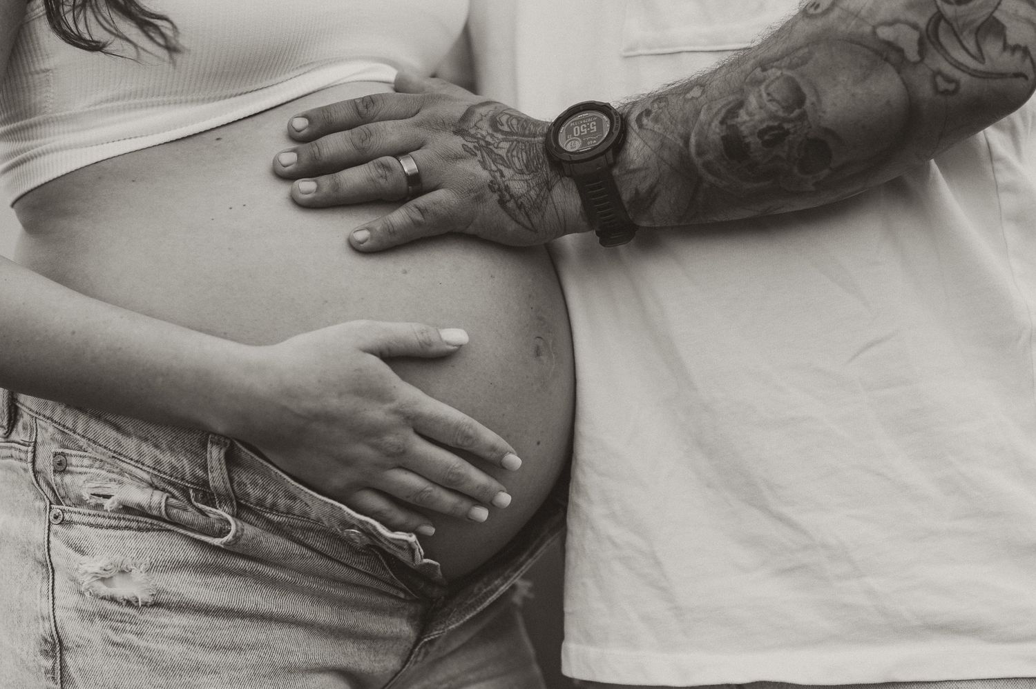 Black and white close up of expecting couple holding bump during maternity session at raccoon mountain chattanooga TN, mountain overlook