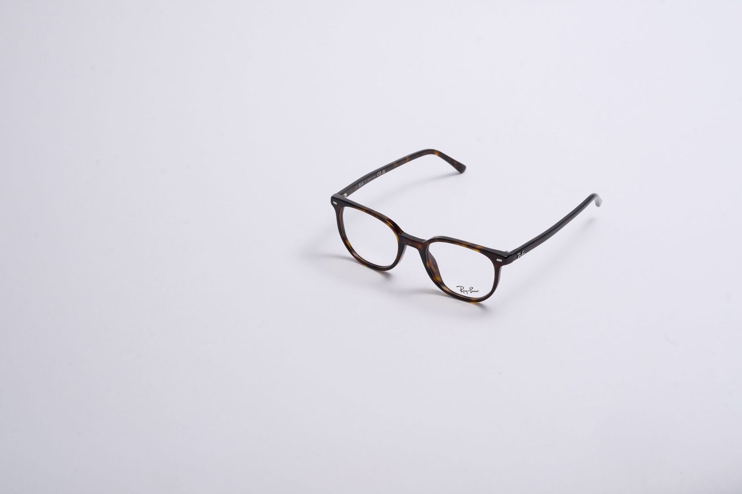 Classic brown eyeglasses with rectangular frames on white background.