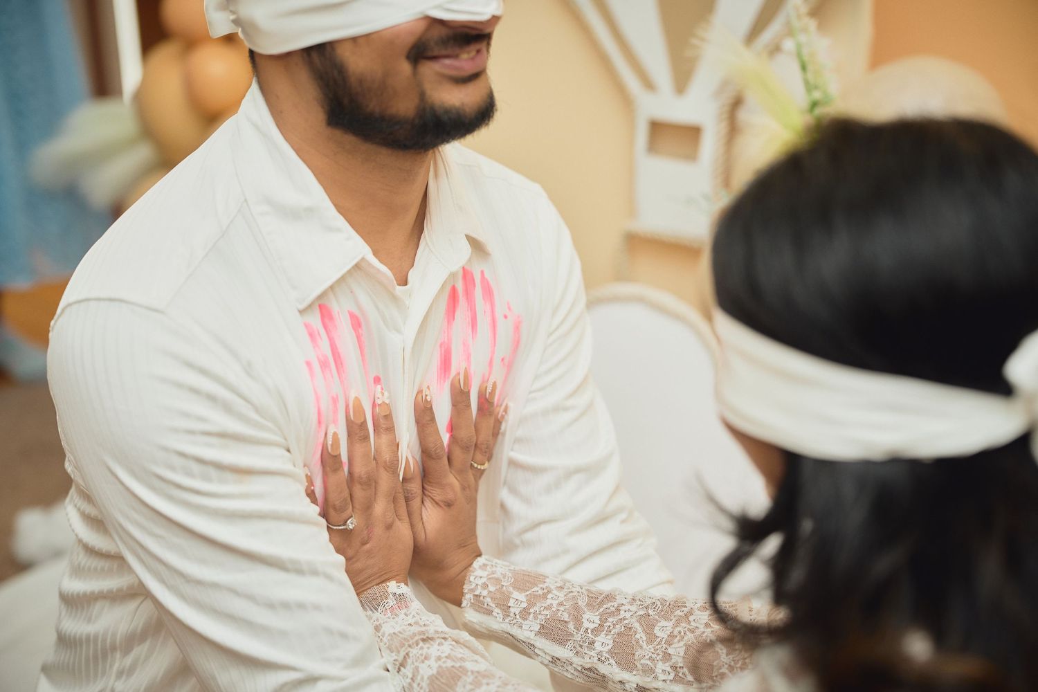 Close up view of traditional henna designs painted on palms during a wedding ceremony celebration.