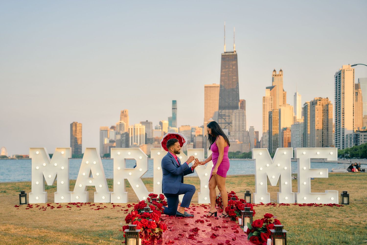 A romantic proposal scene on grass with 