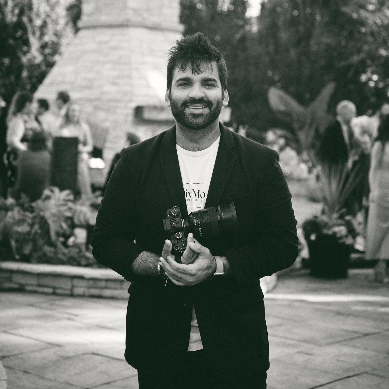 Black and white photo series showing a person in casual attire posing and smiling in an outdoor setting.