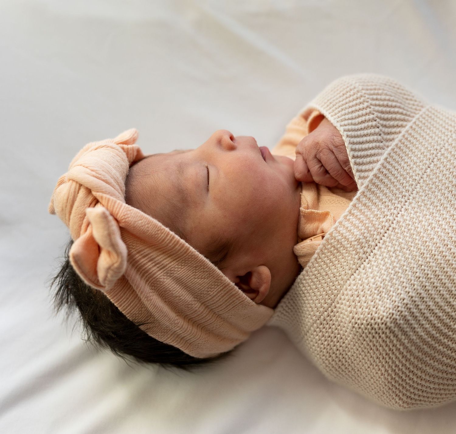 a newborn baby girl sleeping