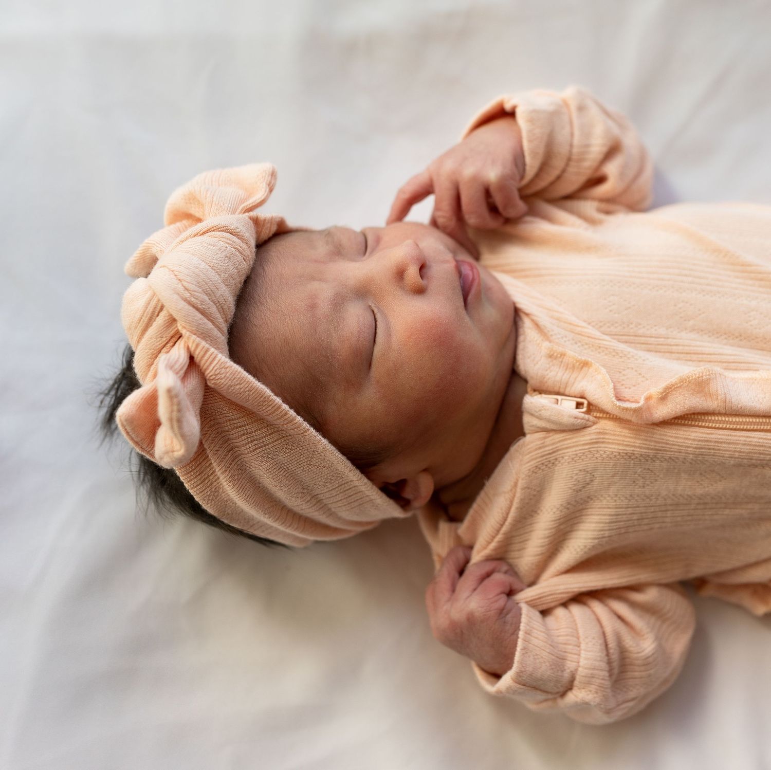 A newborn baby girl sleeping