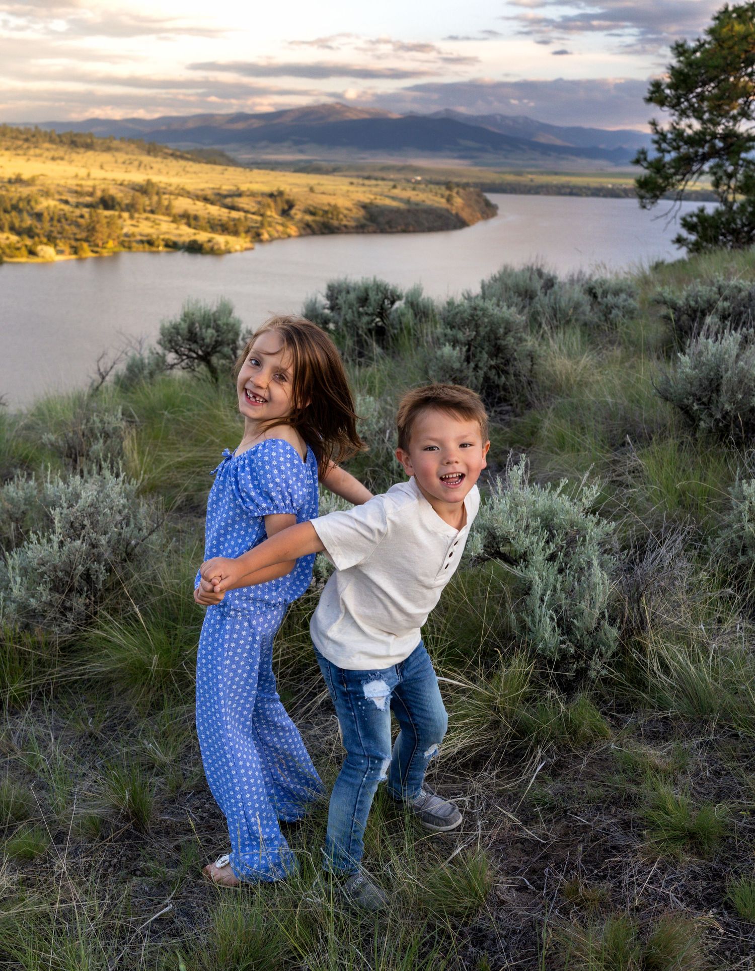 Family portrait with kids playing and laughing