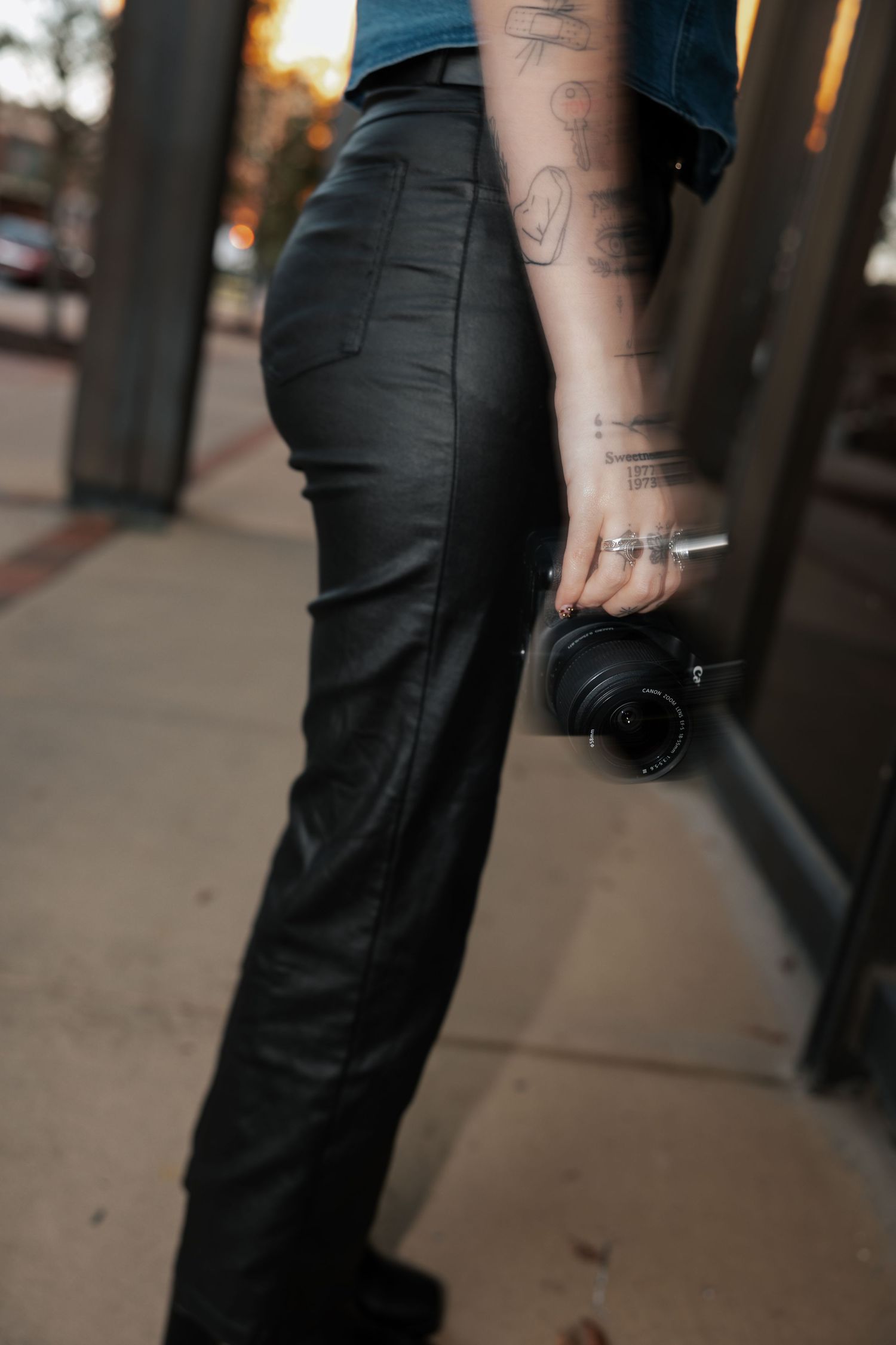 girl hands holding camera, hand in motion with camera