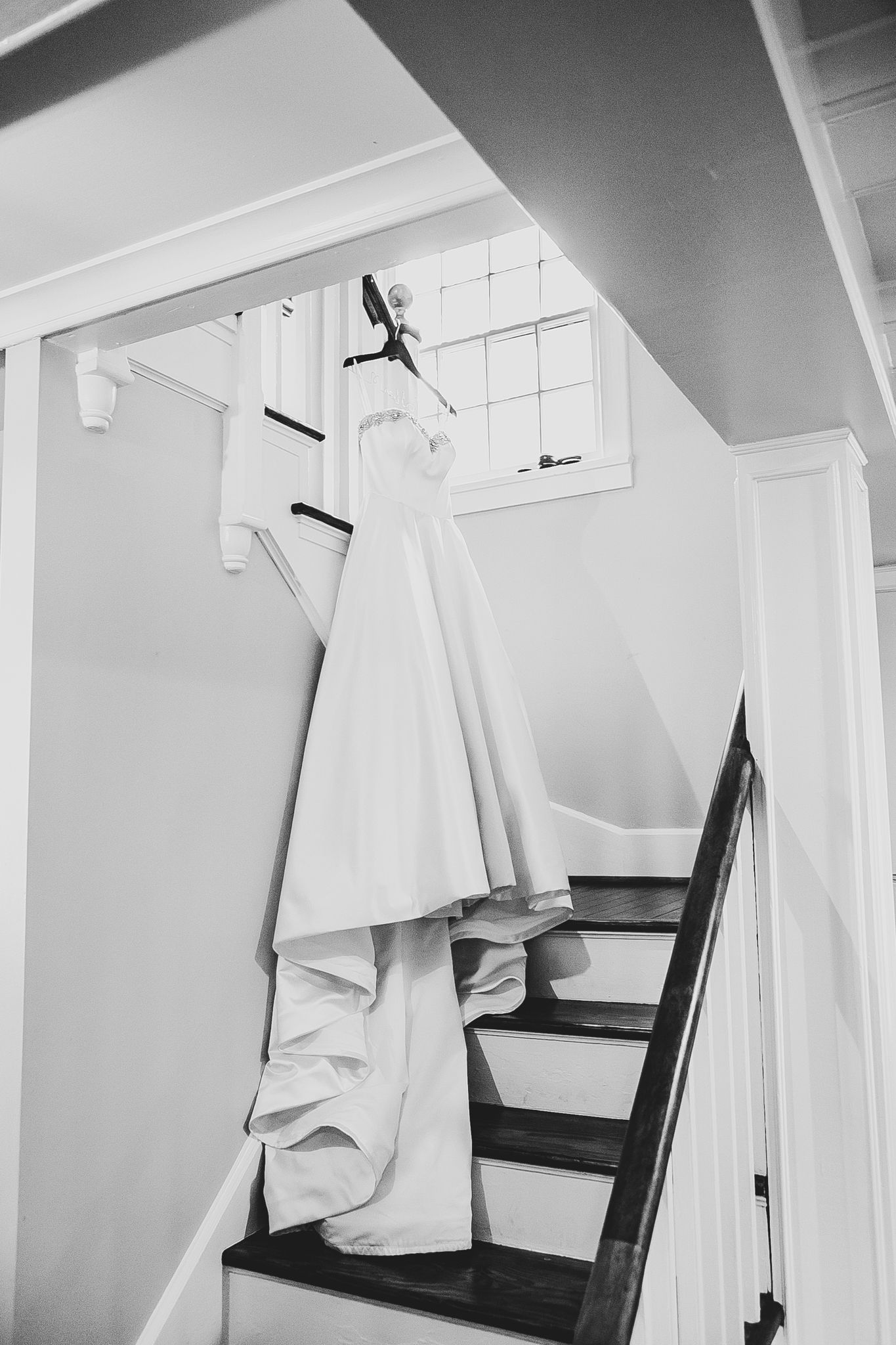 A sequence of 5 similar photos showing a simple white cloth draped over a dark wooden chair against a white wall.