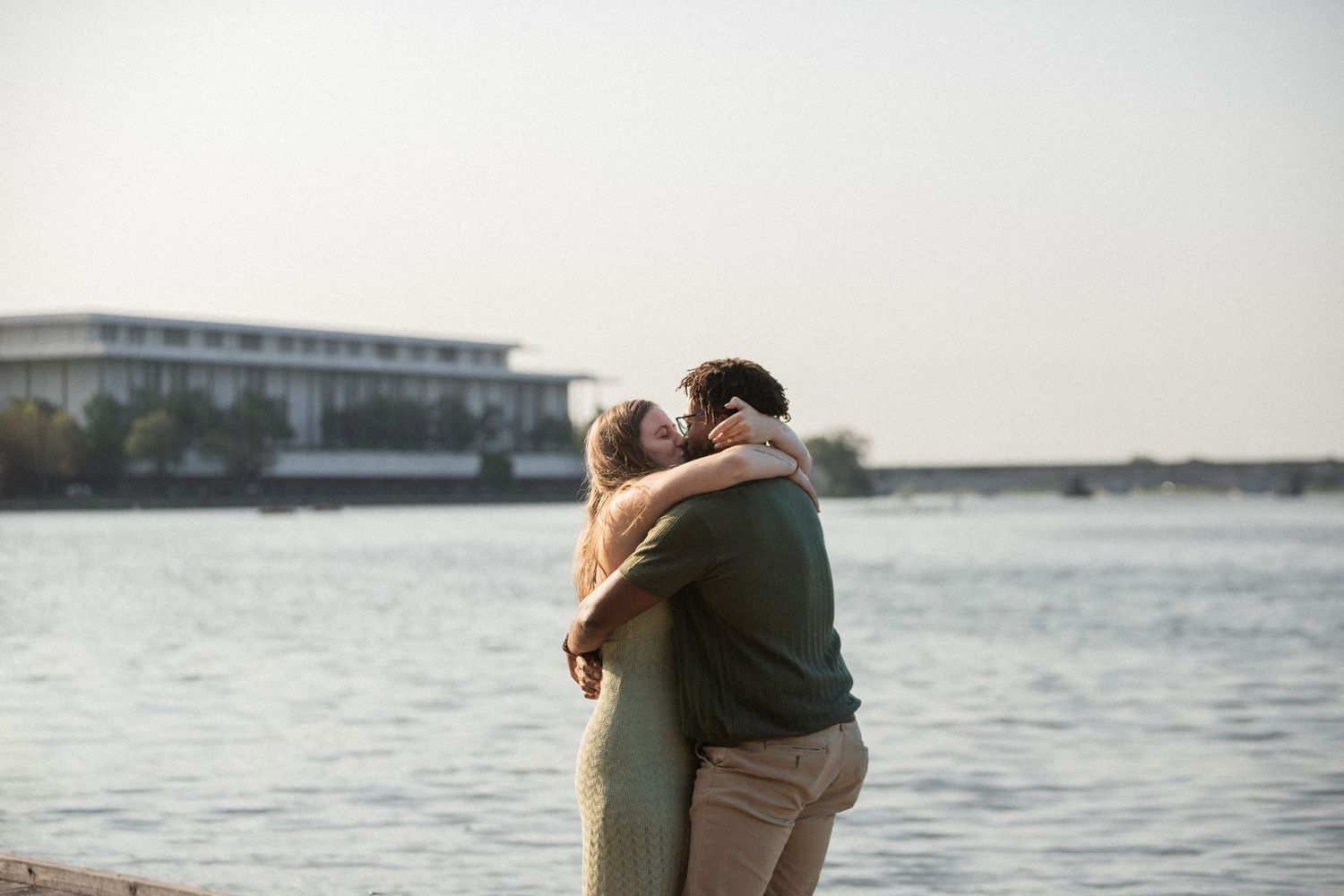 A collage of romantic couples embracing at sunset near the water with soft lighting and muted tones.