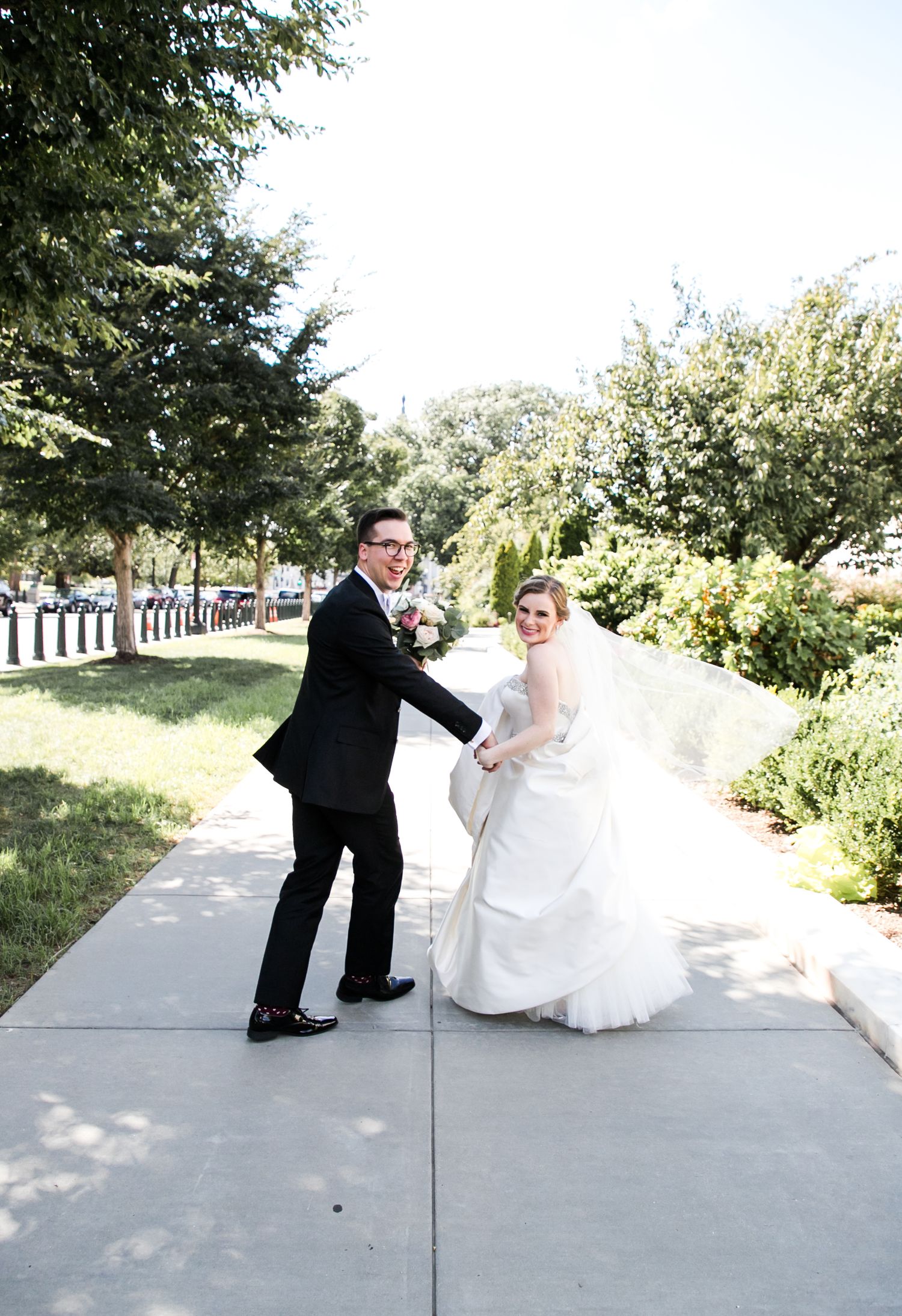 A playful wedding sequence shows a couple recreating the classic bowling pin motion on an outdoor pathway.