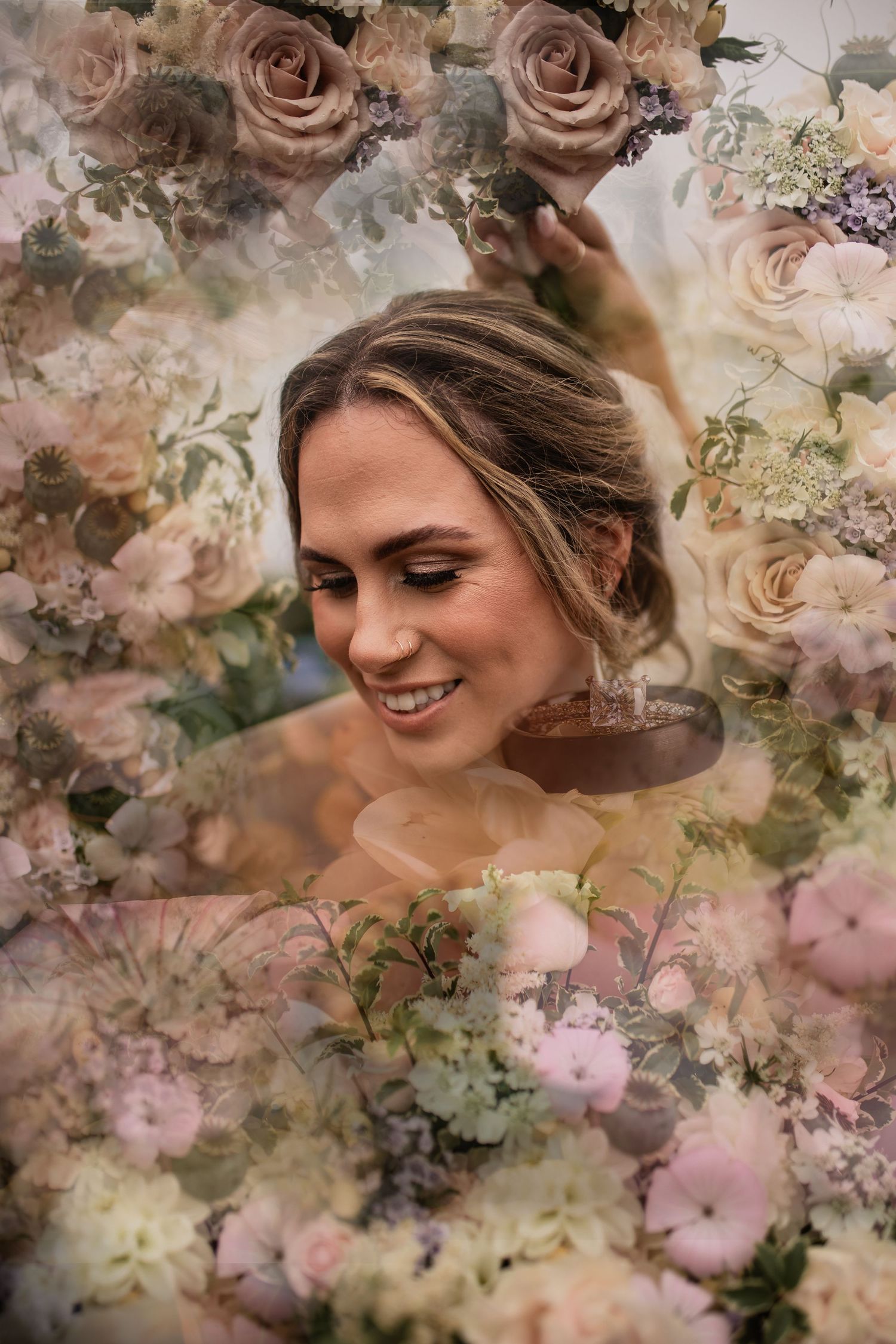 Ethereal bridal portrait surrounded by soft pink roses and dreamy floral overlay.