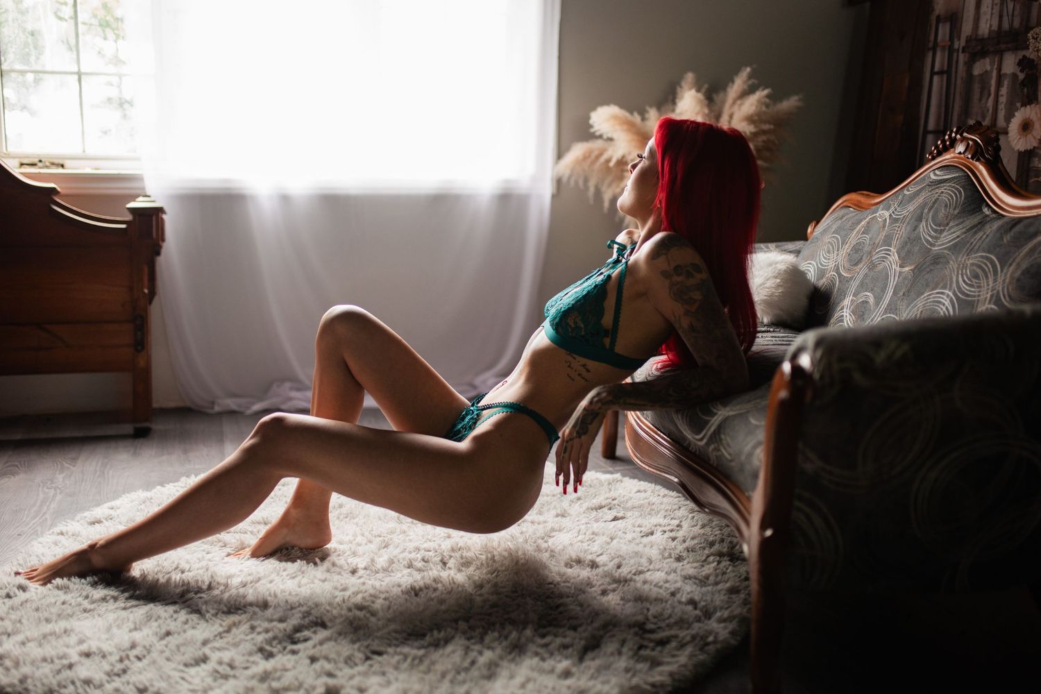 Sunlit boudoir photography sequence capturing relaxed poses on plush white carpet by window.