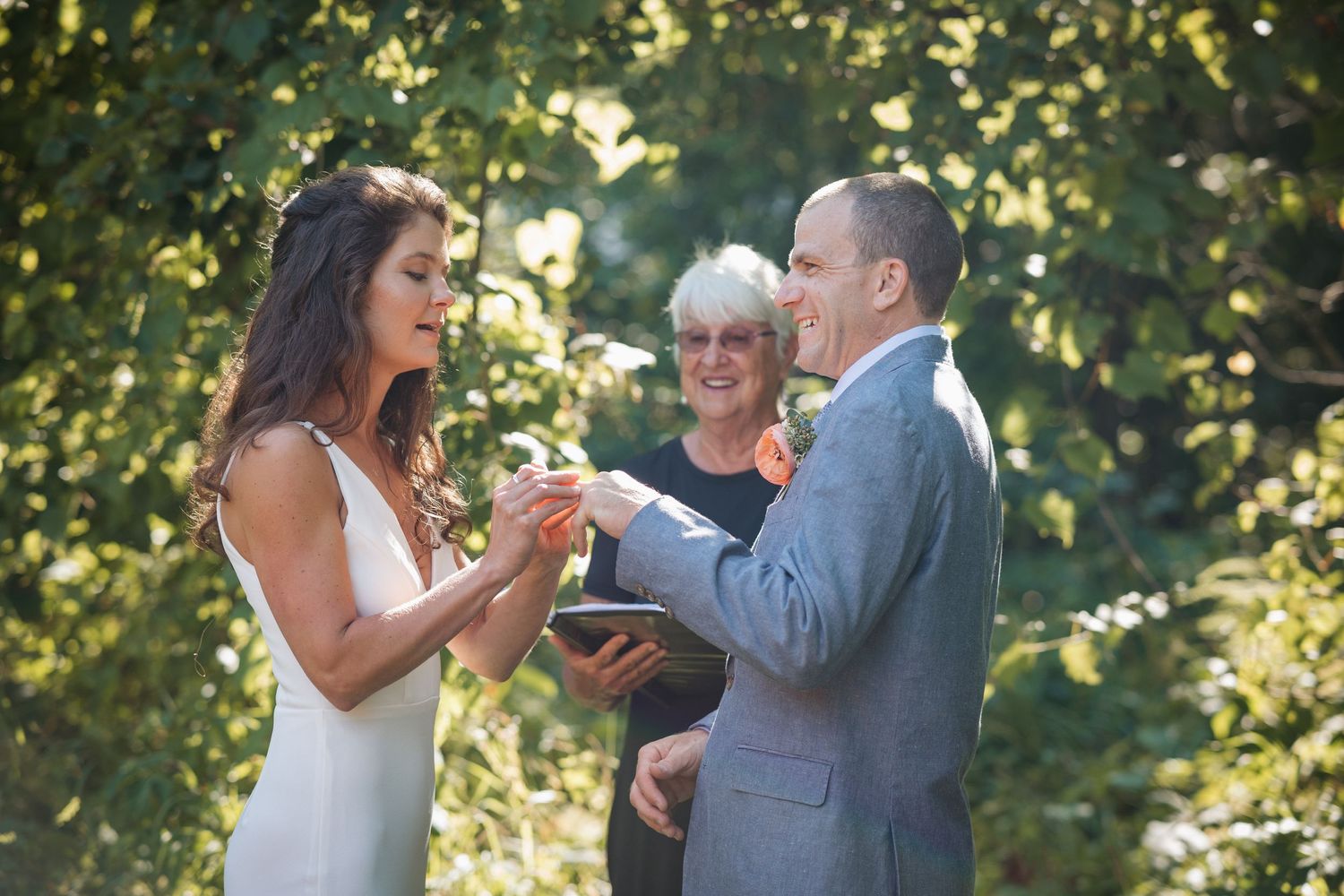 Bride places ring on Grooms finger during this intimate vow exchange at the Inn at Weathersfield in Vermont