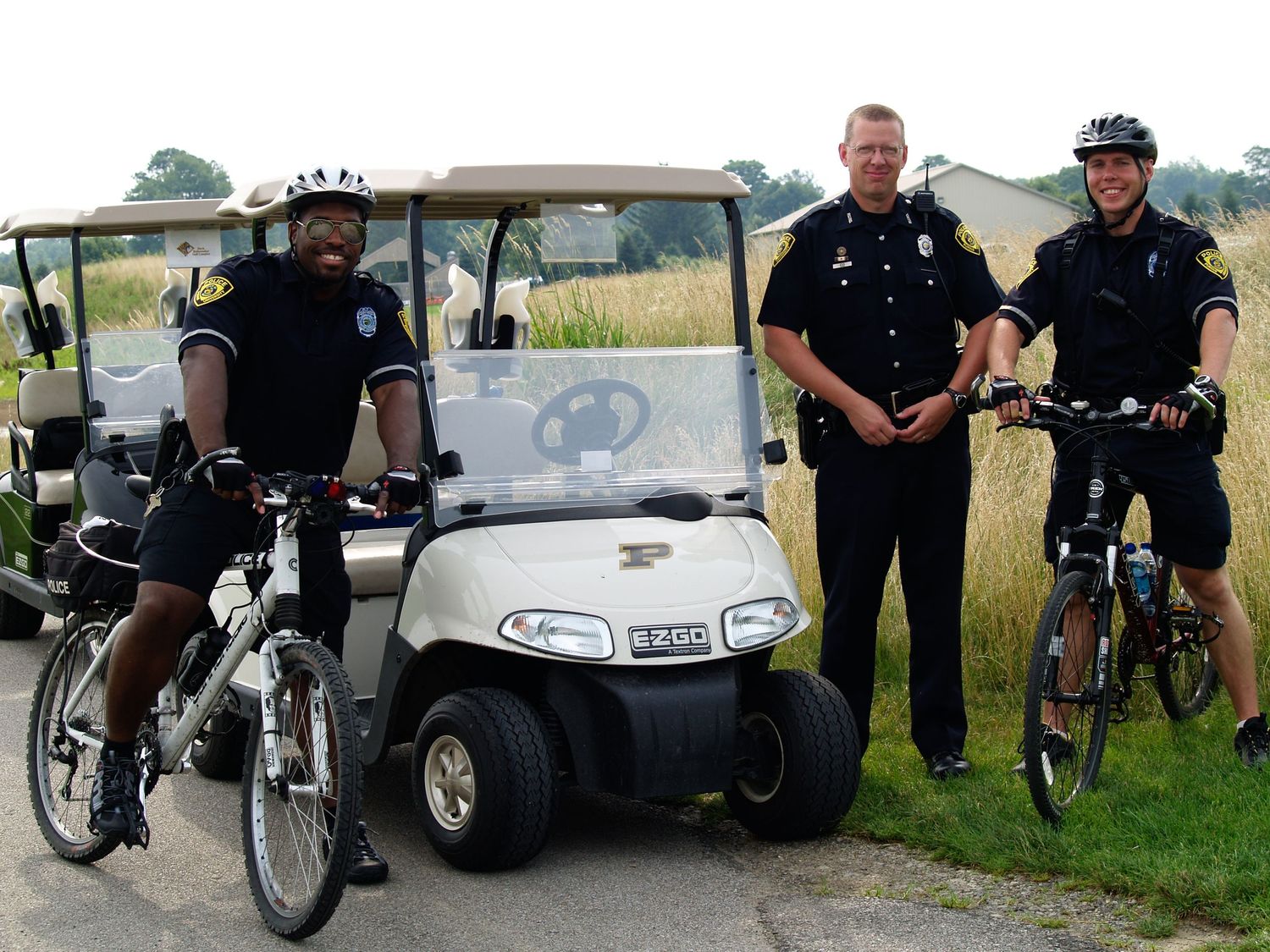 Purdue policeman on bikes and a golf cart