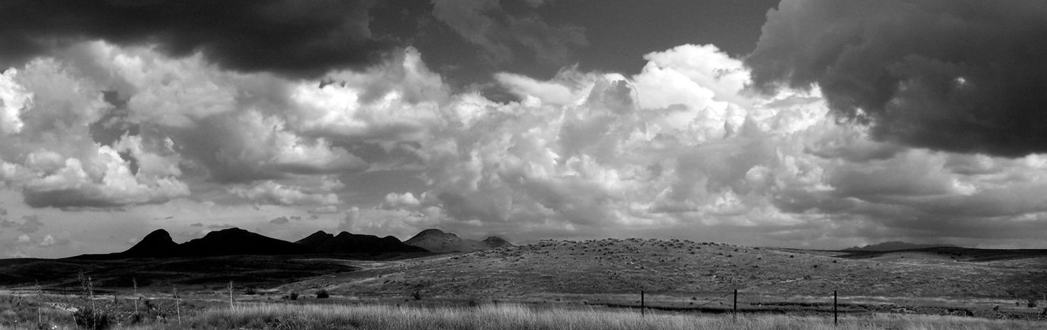 black and white photo of a mountain range