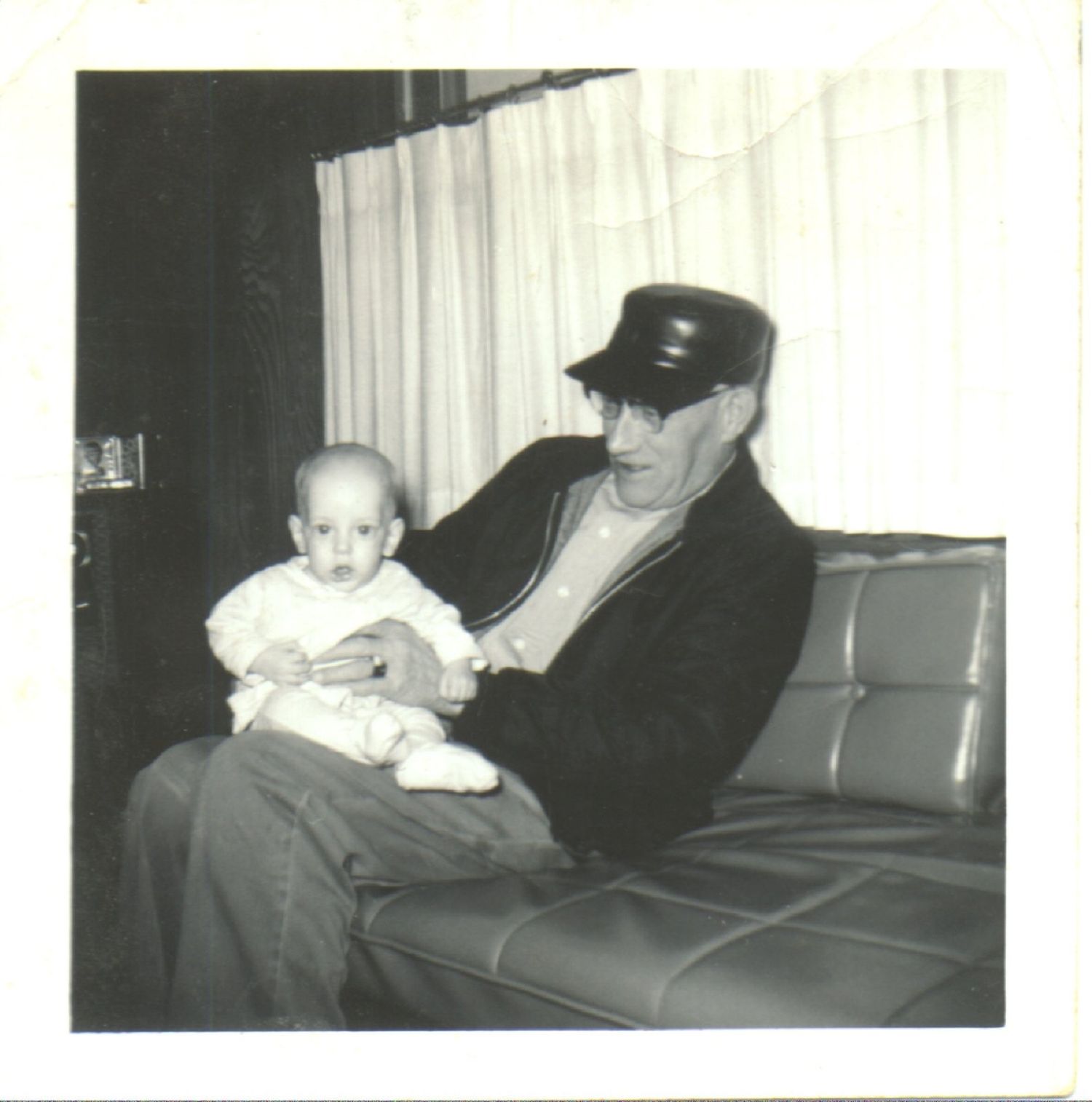 A grandfather holding his grandson