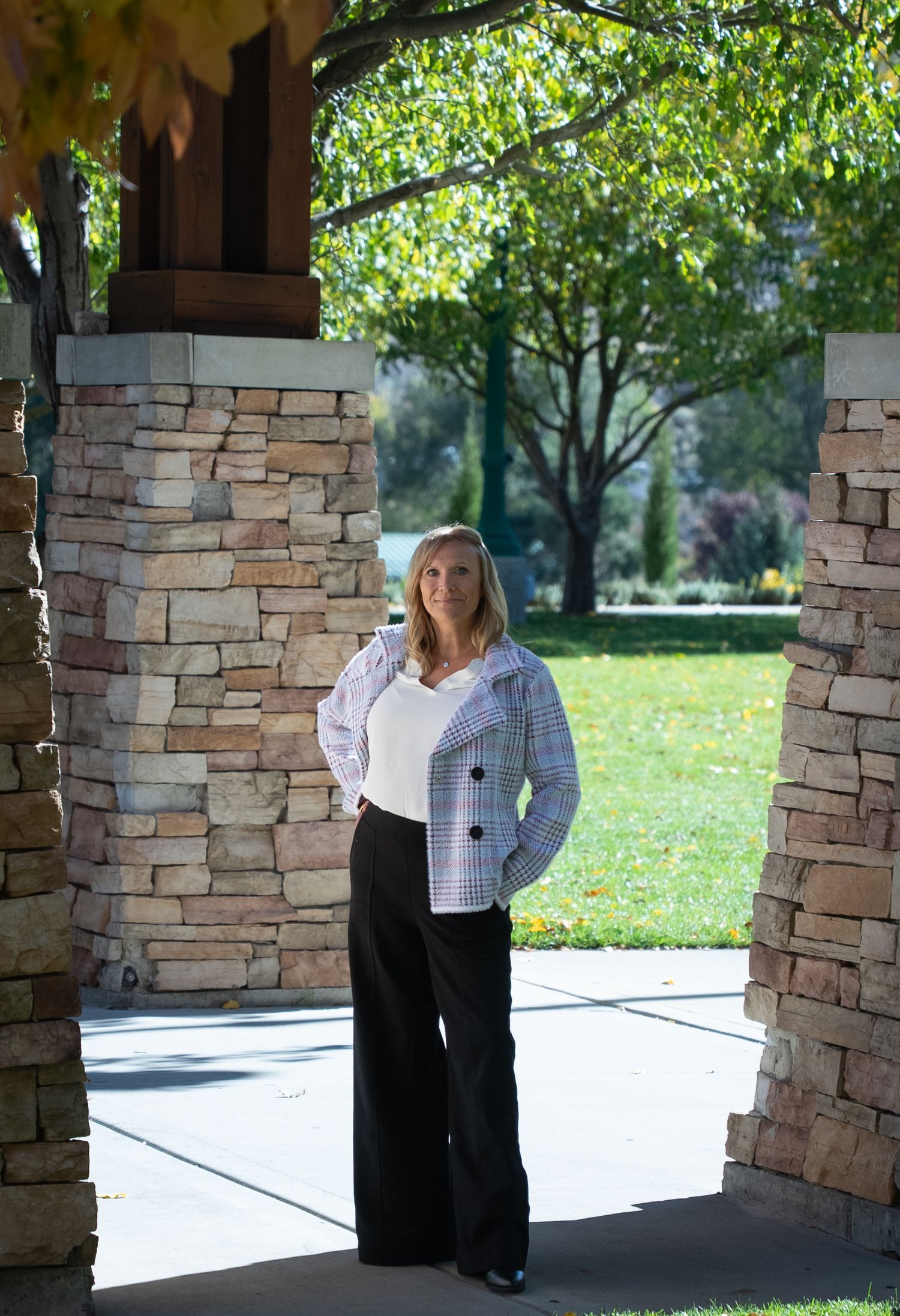Head shot for an entrepreneur's website. Outdoors, standing, looking into camera. Different positions.