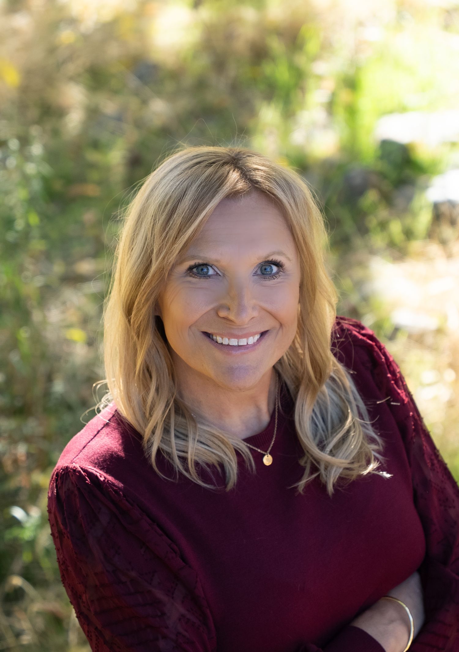 Head shot for an entrepreneur's website. Outdoors, relaxed, looking into camera. Different positions.