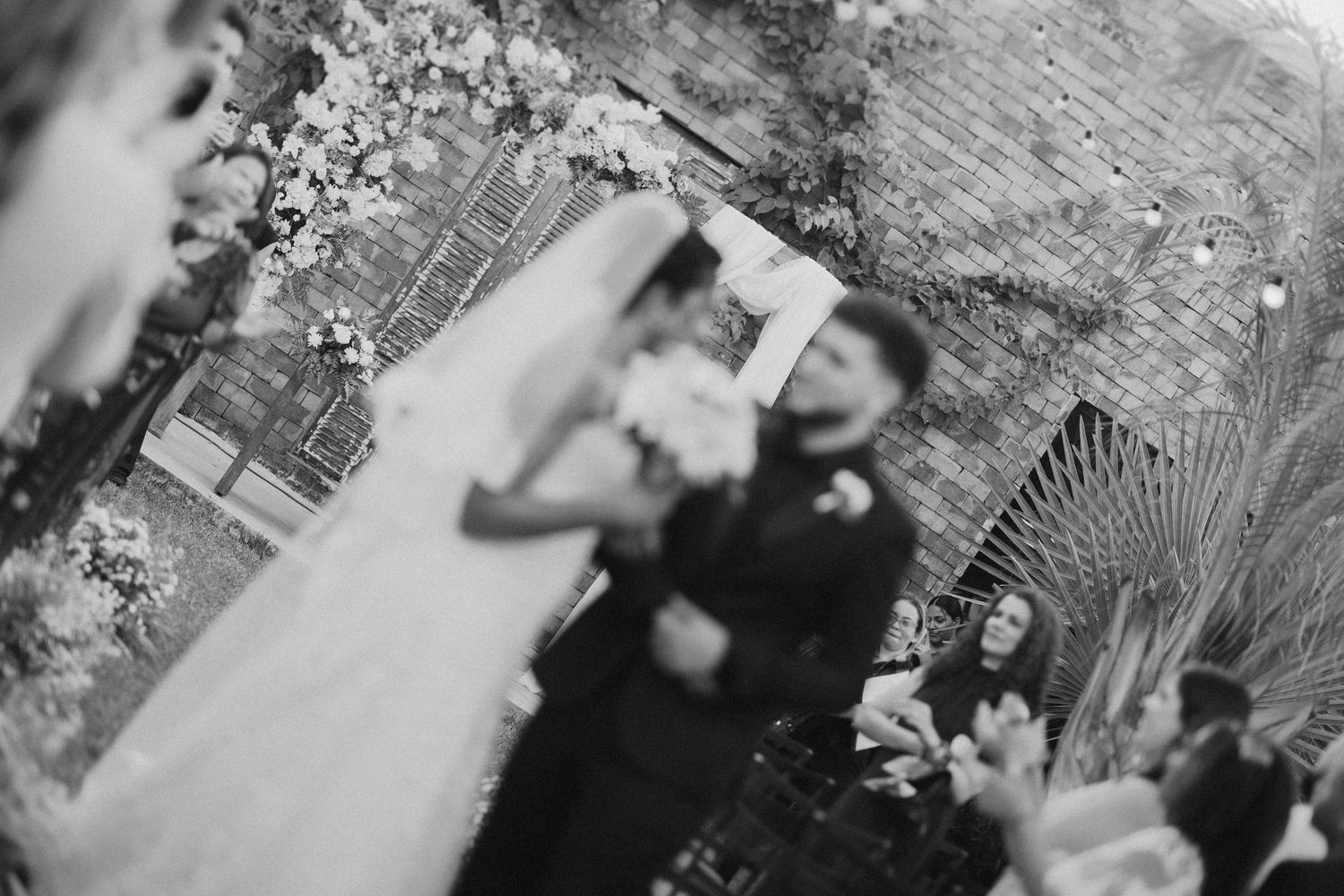 Black and white candid shots of wedding ceremony moments.