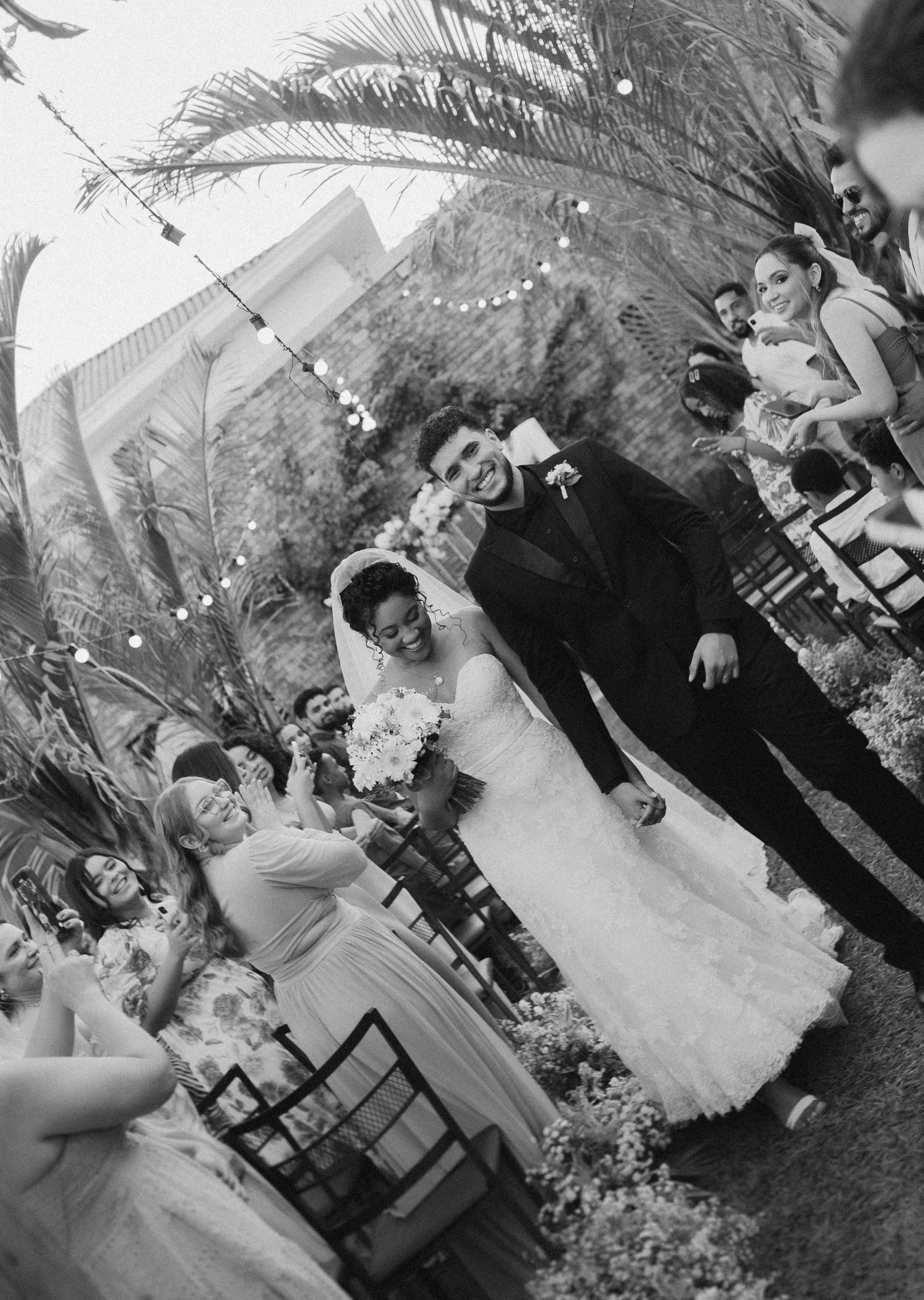 Black and white photos capturing candid wedding ceremony moments.