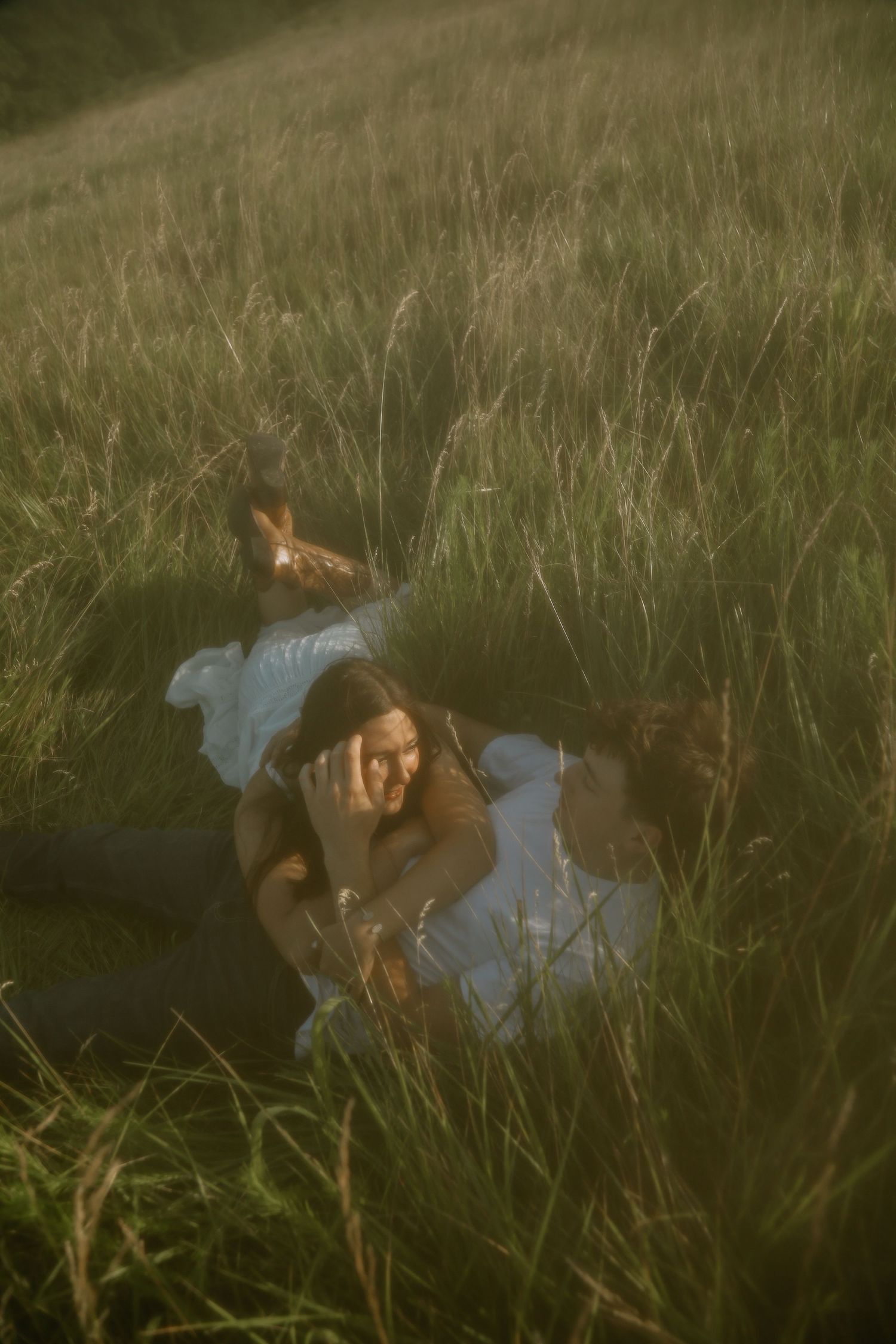 A dreamy portrait in tall grass during golden hour.